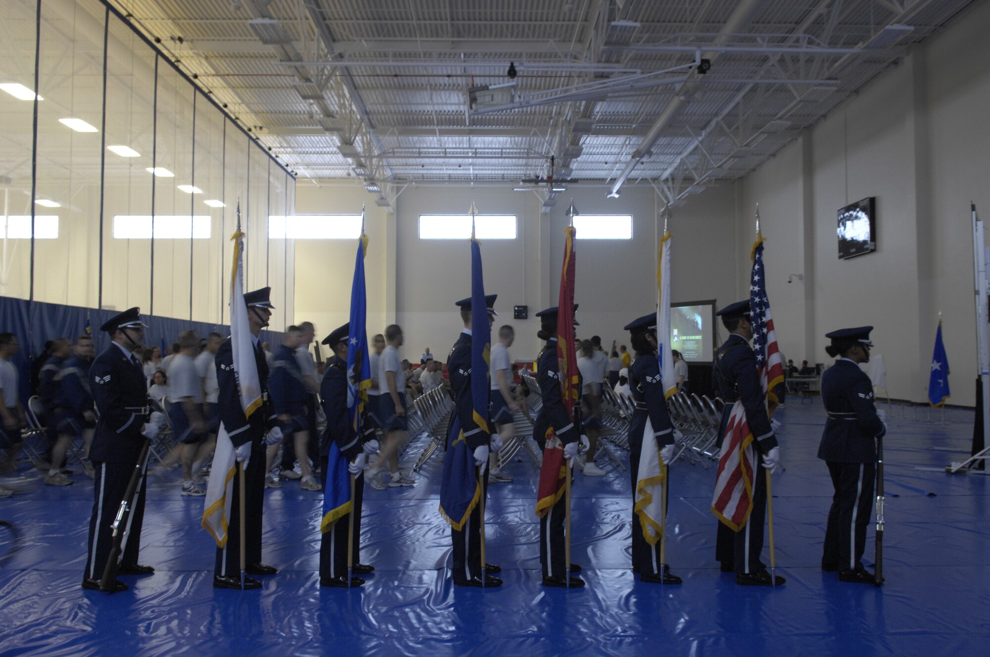 VANDENBERG AIR FORCE BASE, Calif. -- Standing in formation, members of the Vandenberg Honor Guard wait for the closing ceremony of the Run to Remember to begin here Wednesday, Nov. 11, 2009. Held over the last three weeks, The Run to Remember, raised over $4000, involved military members running over 7000 miles to honor the over 5000 fallen American servicemembers during Operations Iraqi and Enduring Freedom. (U.S. Air Force photo/Staff Sgt. Levi Riendeau)