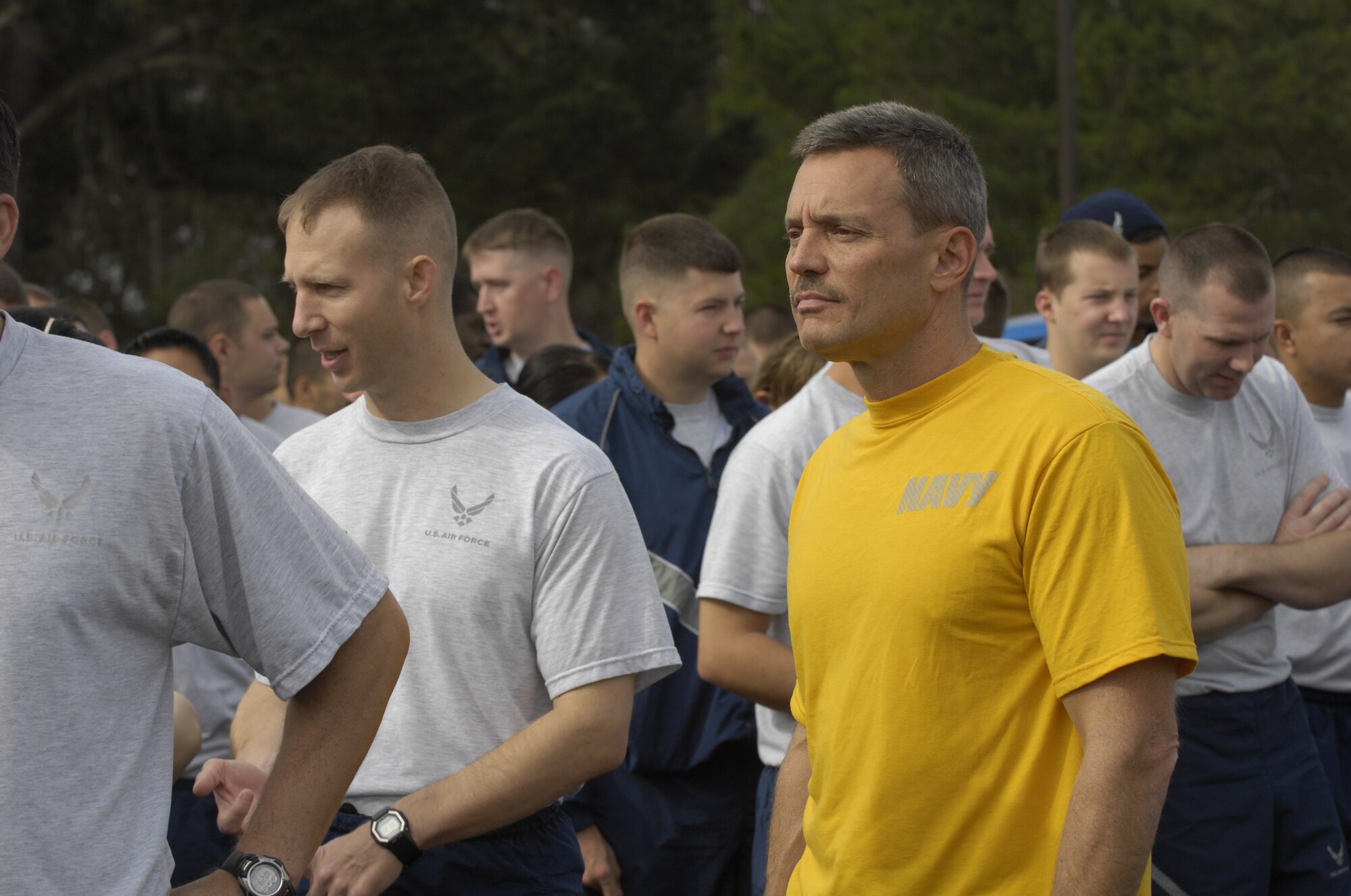 VANDENBERG AIR FORCE BASE, Calif. -- Standing in formation, Navy Lt. Cmdr. Lee Newton, director of manpower and personnel of the Joint Functional Component Command for Space, waits for the final mile of the Run to Remember to start here Wednesday, Nov. 11, 2009. Held over the last three weeks, The Run to Remember, raised over $4000, involved military members running over 7000 miles to honor the over 5000 fallen American servicemembers during Operations Iraqi and Enduring Freedom. (U.S. Air Force photo/Staff Sgt. Levi Riendeau)