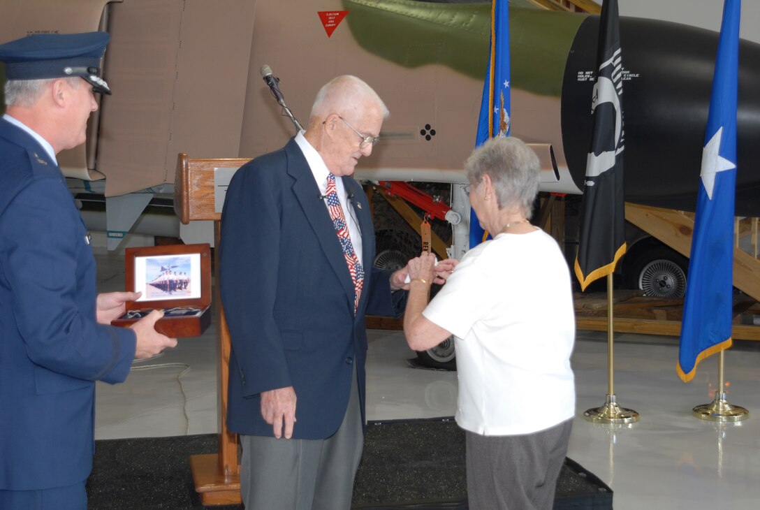 Phyllis Hivner, right, places the original wedding band on retired Air Force Col. James Hivner's left ring finger Oct. 11 at the Cavanaugh Flight Museum in Addison, Texas. It was the first time the colonel has seen, or worn, the ring since Oct. 5, 1965, when he was shot down in North Vietnam. (U.S. Air Force photo/Lou Anne Sledge)
