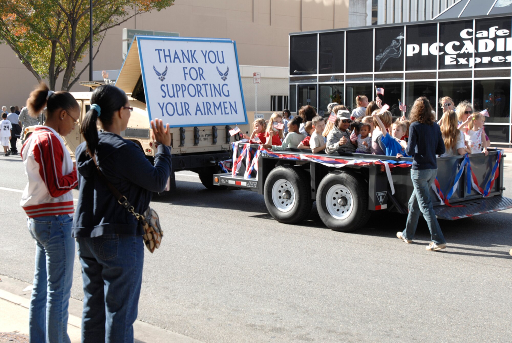 Team McConnell members ride a float in the Veterans Day Parade, Nov. 7, 2009, in Wichita, Kan. Spouses and children of deployed Airmen rode on the float and also marched alongside servicemembers during the parade.  (U.S. Air Force photo/Senior Airman Laura Suttles)