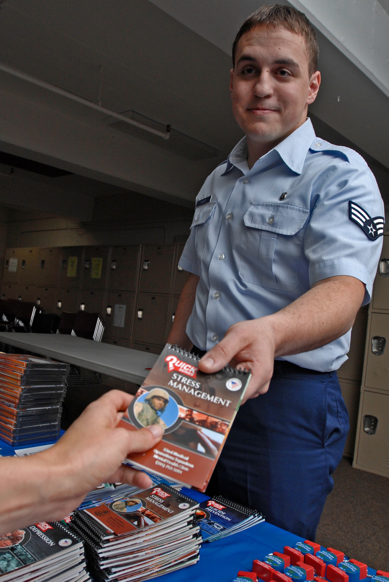 Senior Airman Kevin Yeates hands out stress management manuals at the base clinic Nov. 9, 2009. The Cedar Hill, Texas, native is a mental health technician for the 22nd Medical Operations Squadron. (U.S. Air Force photo/Senior Airman Jessica Lockoski) 