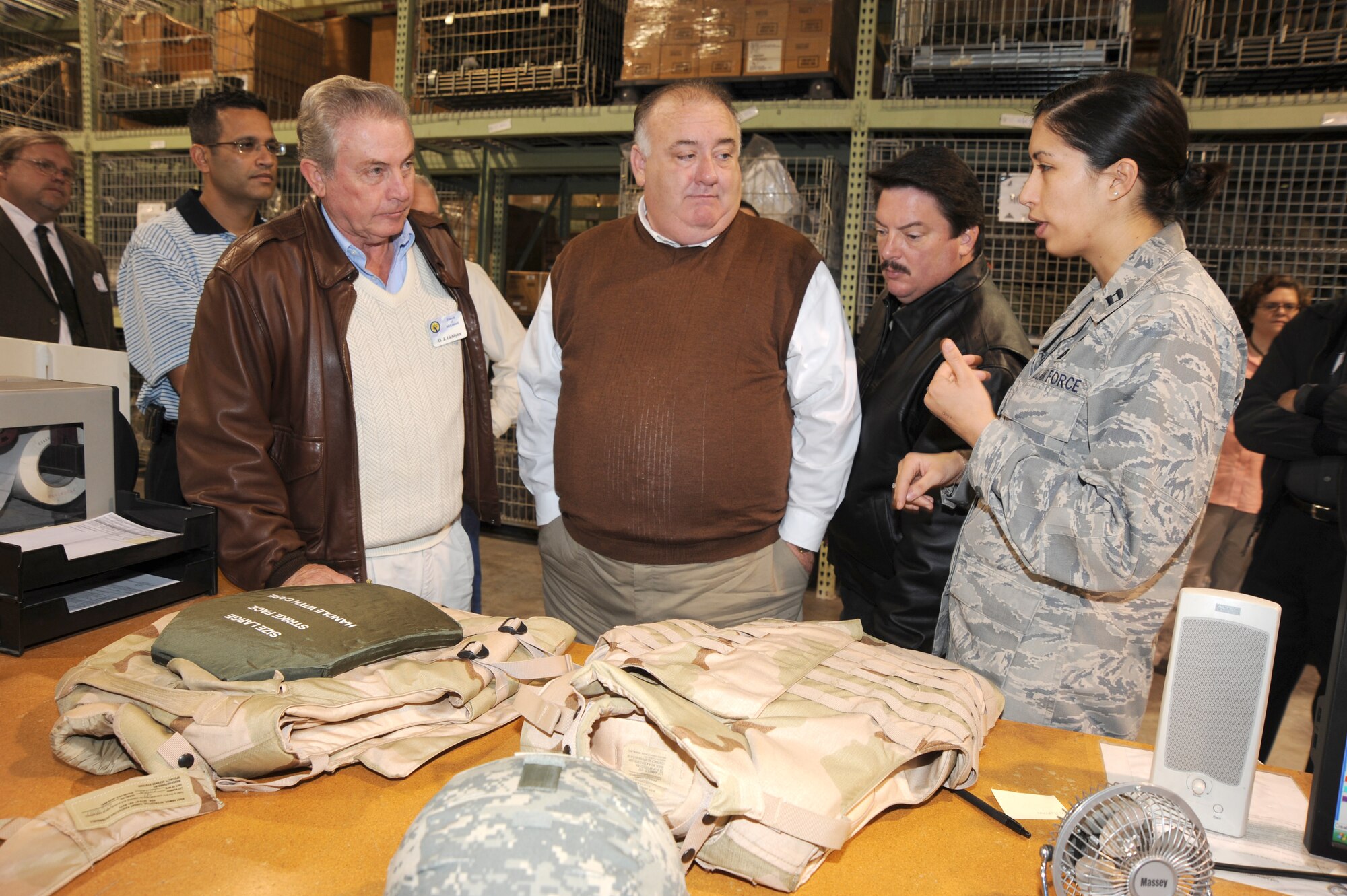 Capt. Kirsten Bethancourt, 22nd Logistics Readiness Squadron, describes the capability of individual body armor to a group of honorary commanders, Oct. 29, 2009, during an honorary commander orientation tour at McConnell Air Force Base, Kan. Honorary commanders are local community partners who are paired with base commanders for a year or more. They spend their tenure learning about the base’s mission, assets and program. (U.S. Air Force photo by Tech. Sgt. Chyrece Campbell)  