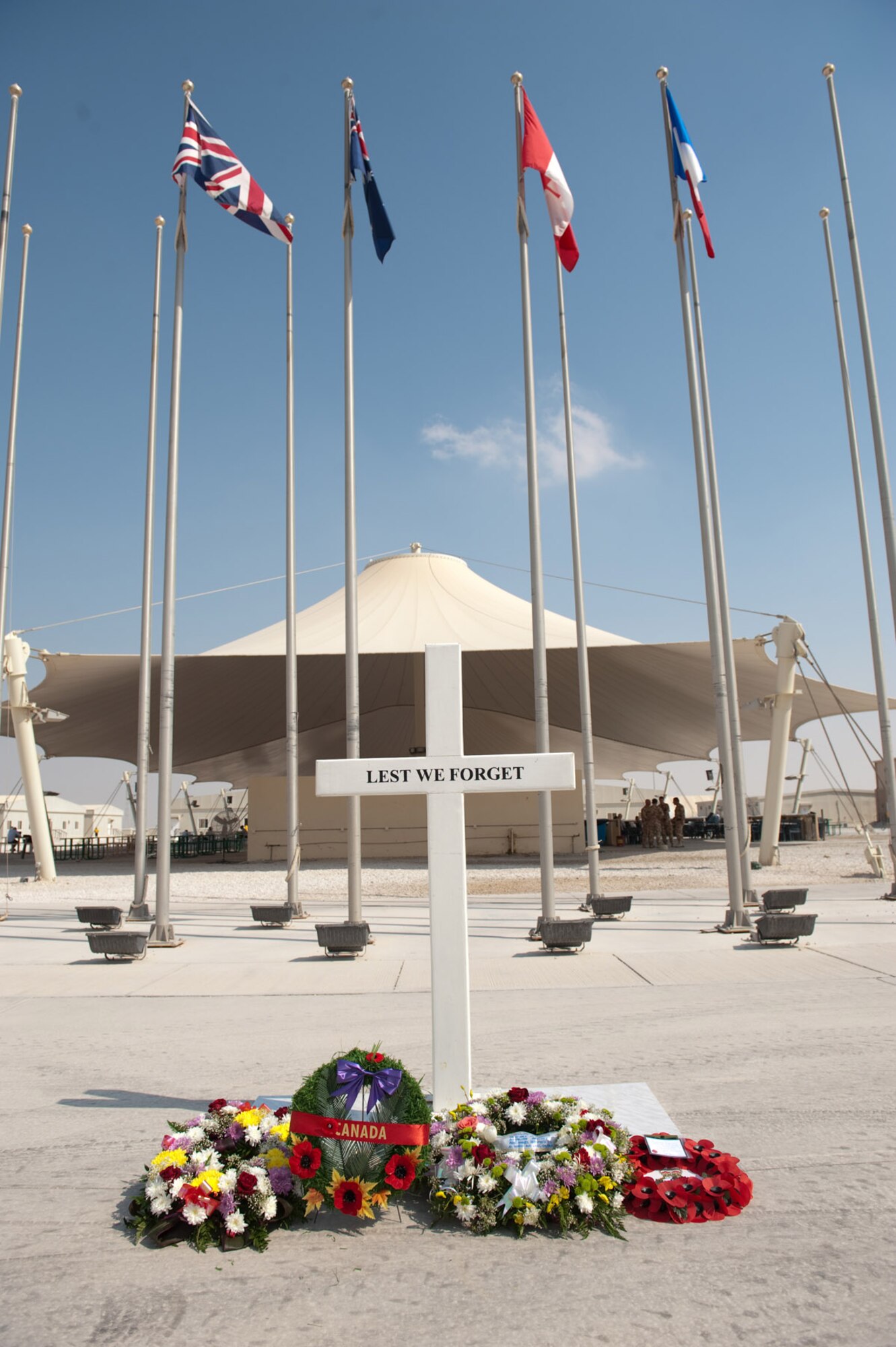 SOUTHWEST ASIA -- A memorial of wreaths lay after a Remembrance Day ceremony for the U.K., Australia, Canada, and France Nov. 11, 2009, in a deployed location in Southwest Asia. Military personnel from the U.K., Australia, Canada, France, and the United States took time from their duties in support of current military operations to commemorate the sacrifice of their fellow military personnel from past and current conflicts. (U.S. Air Force photo/Staff Sgt. Robert Barney) 