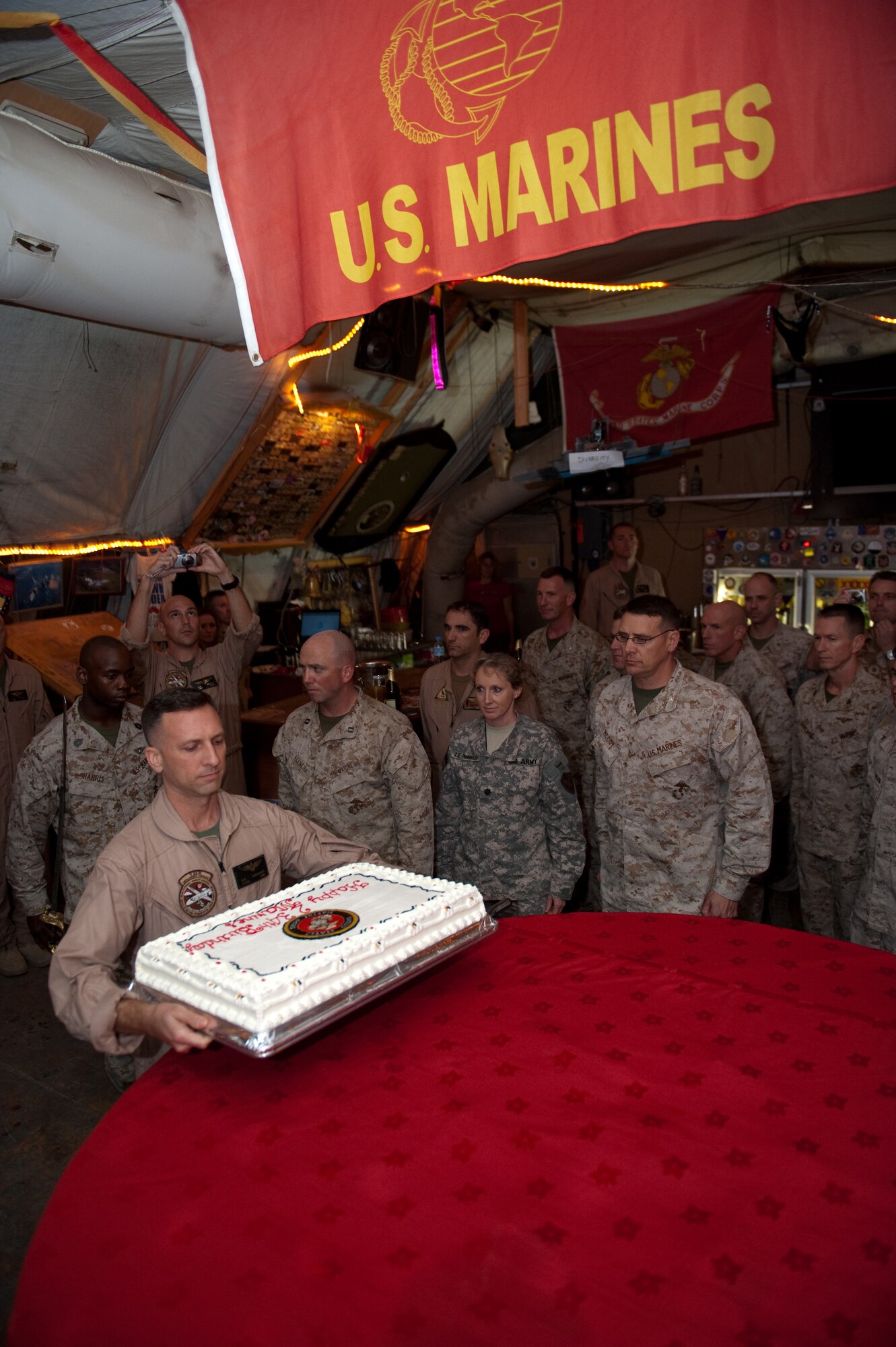 U.S. Marine Corps Lt. Col. Keith Kincannon brings out the USMC's 234th birthday cake during their birthday celebration, Nov. 10, 2009, in Southwest Asia. (U.S. Air Force photo/Staff Sgt. Robert Barney)