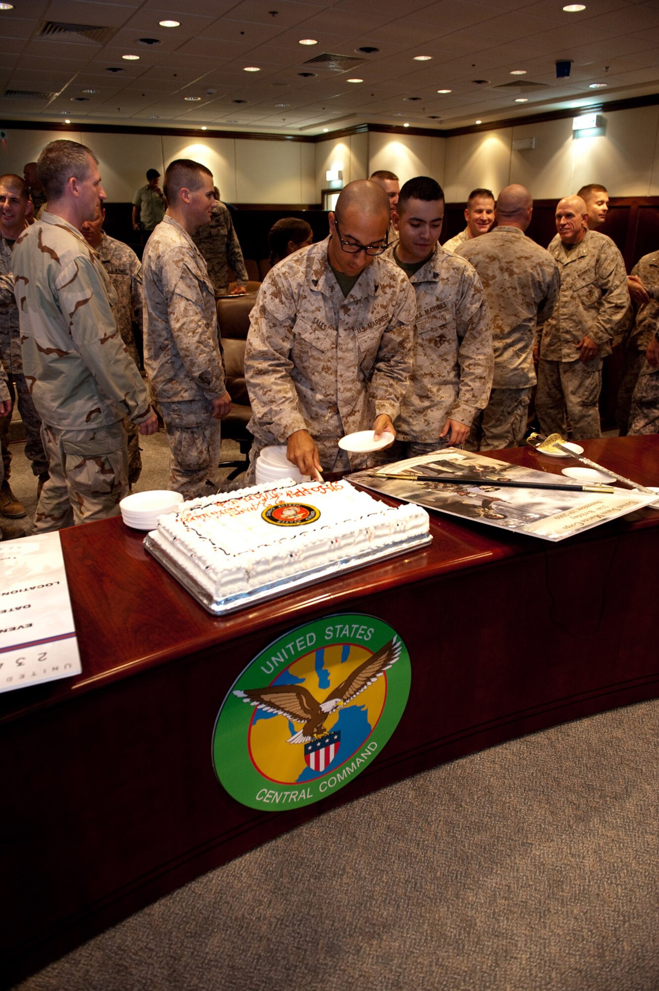 U.S. Marine Corps servicemembers, along with fellow military servicemembers, enjoy birthday cake during a celebration honoring the 234th birthday of the USMC, Nov. 10, 2009, in Southwest Asia. (U.S. Air Force photo/Staff Sgt. Robert Barney)