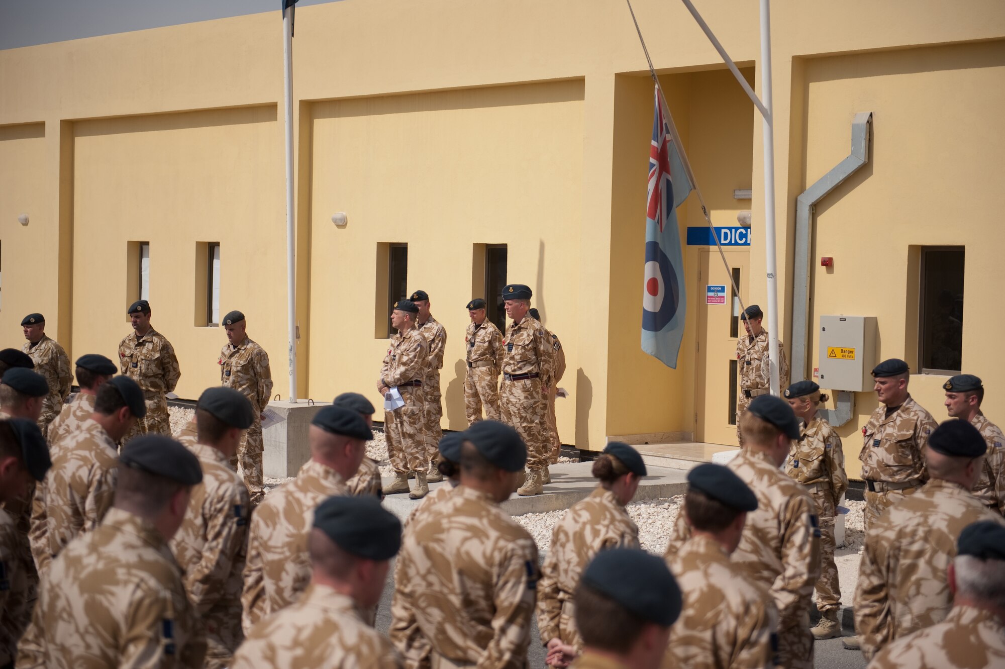 Members of the Royal Air Force 83rd Expeditionary Air Group hold a traditional Sunday Remembrance reflection ceremony in a deployed environment for Soldiers, Sailors and Airmen of the United Kingdom armed services, Nov. 8, 2009, in Southwest Asia. The RAF 83 EAG held a traditional Sunday Remembrance reflection ceremony to honor those who have made the ultimate sacrifice, reading the names of those killed over the last year and observing two minutes of silence.  (U.S. Air Force photo/Staff Sgt. Robert Barney) 