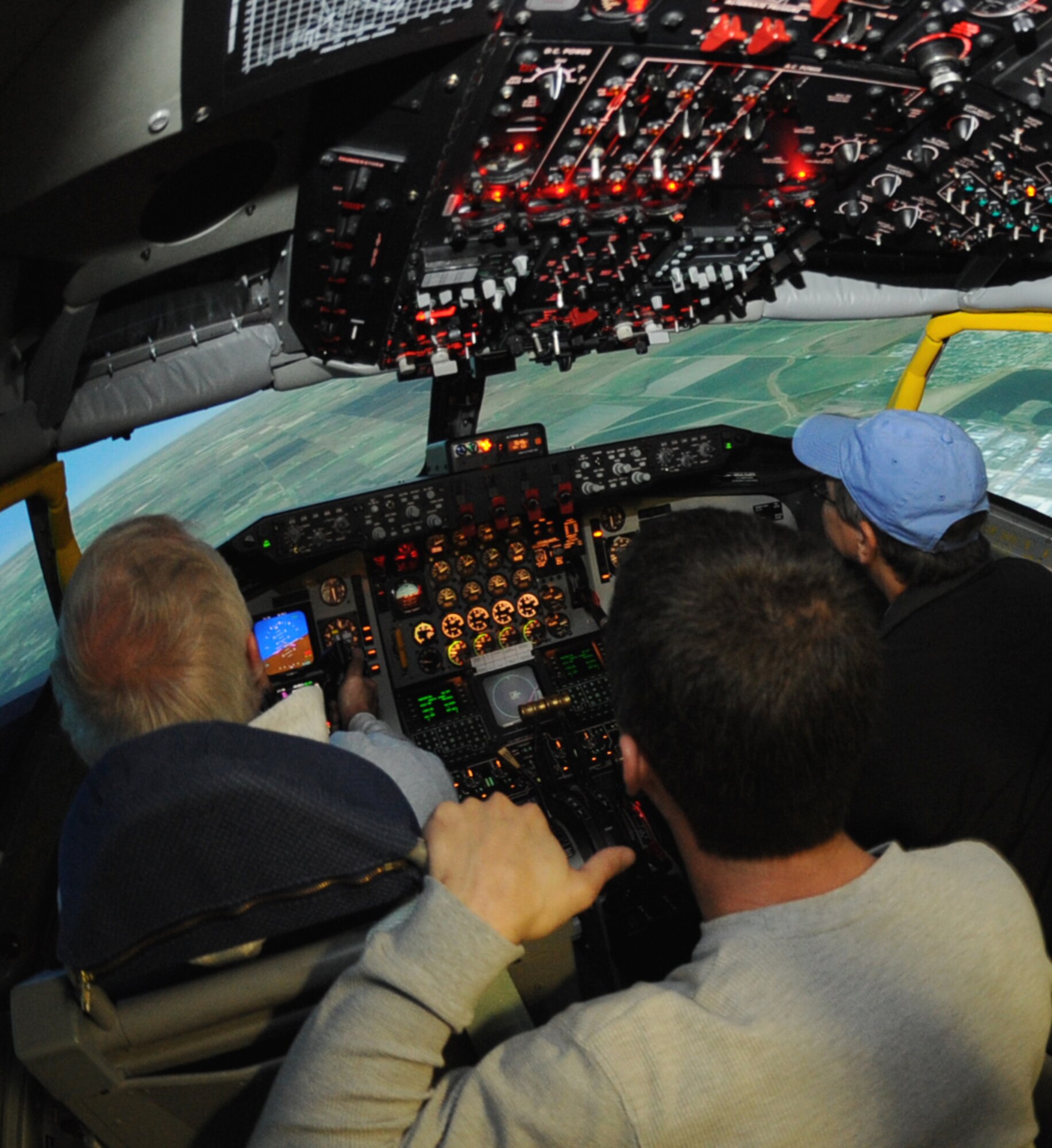 National Institute for Aviation Research members from Wichita State University fly a KC-135 Stratotanker simulator at McConnell Air Force Base, Kan., Nov. 2, 2009, during a base tour. The NIAR aging aircraft laboratory investigates aircraft problems caused by corrosion and fatigue by disassembling and inspecting aircraft. The lab also researches safe ways to extend the service life of aircraft. (U.S. Air Force Photo/Airman 1st Class Ruiz)