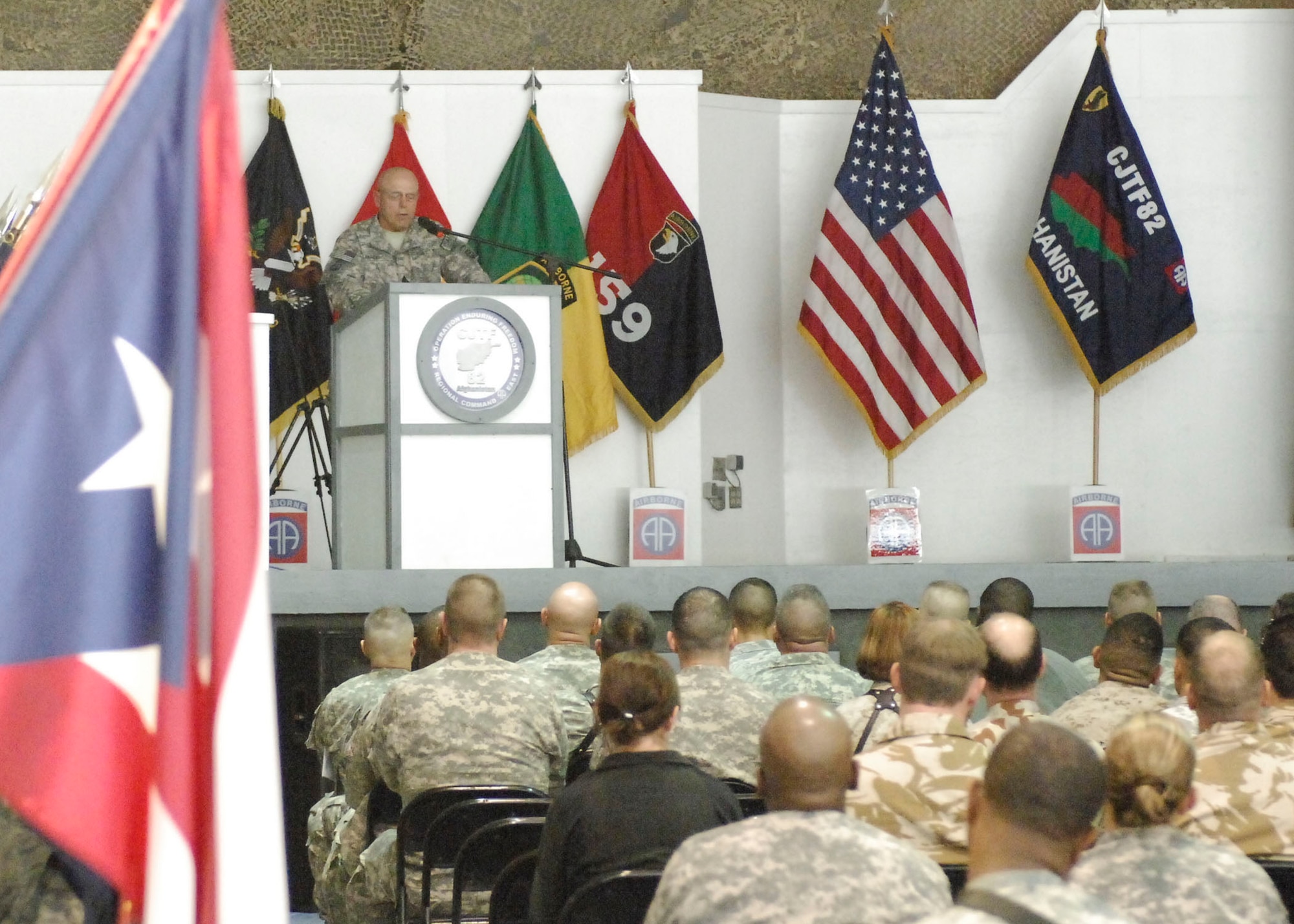 BAGRAM AIRFIELD, Afghanistan -- Retired Army Command Sgt. Major David Henderson, now the safety director for the 82nd Airborne Division, speaks during a Veteran's Day Ceremony Nov. 11, 2009.  Command Sergeant Major Henderson served the majority of his Army career at Fort Bragg as a paratrooper and retired as a brigade command sergeant major; he hails from Bainbridge, Ga.  (U.S. Air Force photo/Senior Airman Felicia Juenke)