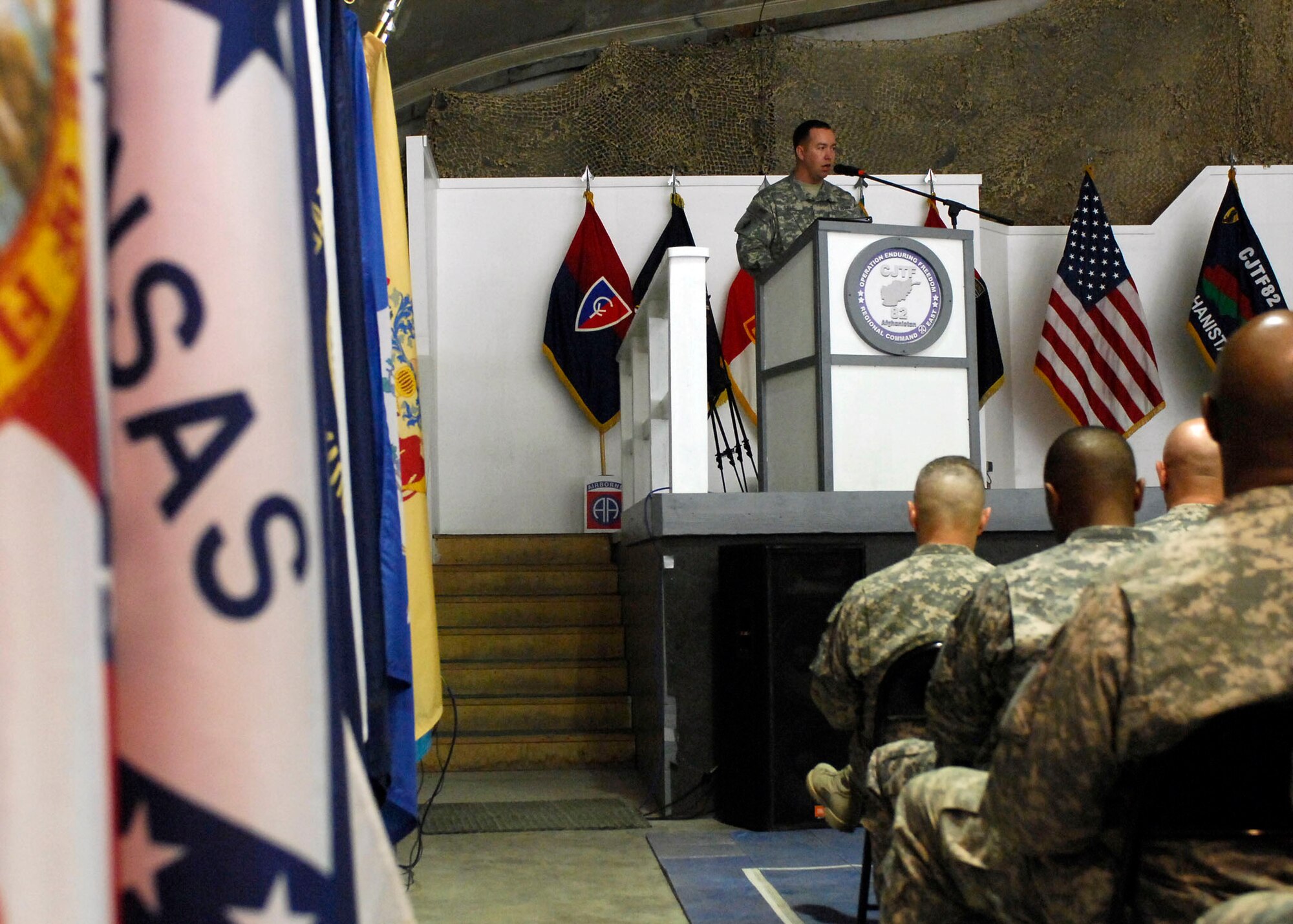 BAGRAM AIRFIELD, Afghanistan -- Army Sgt. First Class Raleigh Sell, the protocol non-commissioned officer in charge from Combined Joint Task Force 82, performs emcee duties during a Veteran's Day Ceremony Nov. 11, 2009.  Sergeant Sell is deployed from Fort Bragg, N.C., and hails from Griffith, Ind.  (U.S. Air Force photo/Senior Airman Felicia Juenke)