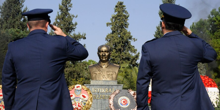 Col. Lawrence Gray, 39th Air Base Wing vice commander, and Col. Deniz Kartepe, 10th Tanker Base operations commander, salute the monument of Mustafa Kemal Ataturk during the Ataturk Memorial Day Ceremony, Tuesday, Nov. 10, 2009 in front of the 10th Tanker Base Command Headquarters. The ceremony was open to all members of the Incirlik community.  (U.S. Air Force photo/Airman 1st Class Amber Ashcraft)