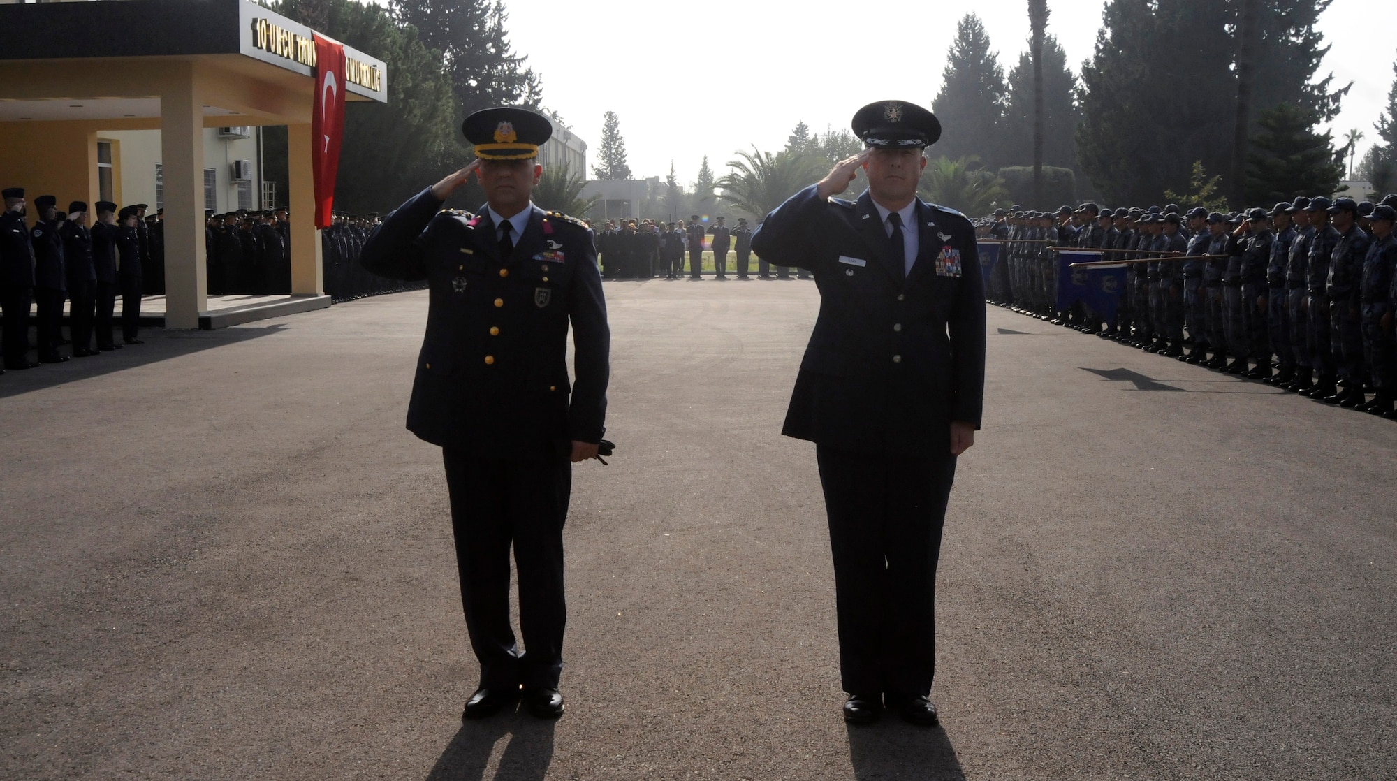 Col. Deniz Kartepe, 10th Tanker Base operations commander, and Col. Lawrence Gray, 39th Air Base Wing vice commander, salute to Turkey’s national anthem during the Ataturk Memorial Day Ceremony, Tuesday, Nov. 10, 2009 in front of the 10th Tanker Base Command Headquarters. The ceremony was open to all members of the Incirlik community.  (U.S. Air Force photo/Airman 1st Class Amber Ashcraft)