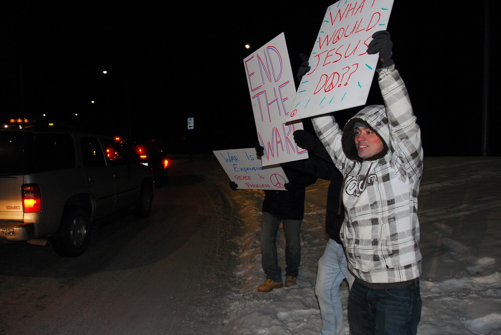 Airman Ryan Kurth and other 354th Fighter Wing Airmen simulate a protest at the main gate during an exercise inject to test security forces response Nov. 5, 2009 at Eielson Air Force Base, Alaska. The event was one of dozens throughout the week to help test and evaluate the wings agencies in their ability to respond to situations. Airman Kurth is assigned to the 354th Aircraft Maintenance Squadron. (U.S Air Force photo/Tech. Sgt. Shad Eidson)