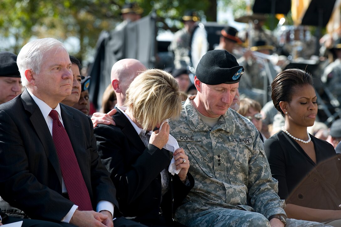 Jill Cone, wife of Army Lt. Gen. Robert Cone, Commanding General of III Corps and Ft. Hood, wipes away her tears during a memorial ceremony honoring the 13 fallen heroes who were killed at the Army processing station on Nov. 5, on Fort Hood, Texas, Nov. 10, 2009.