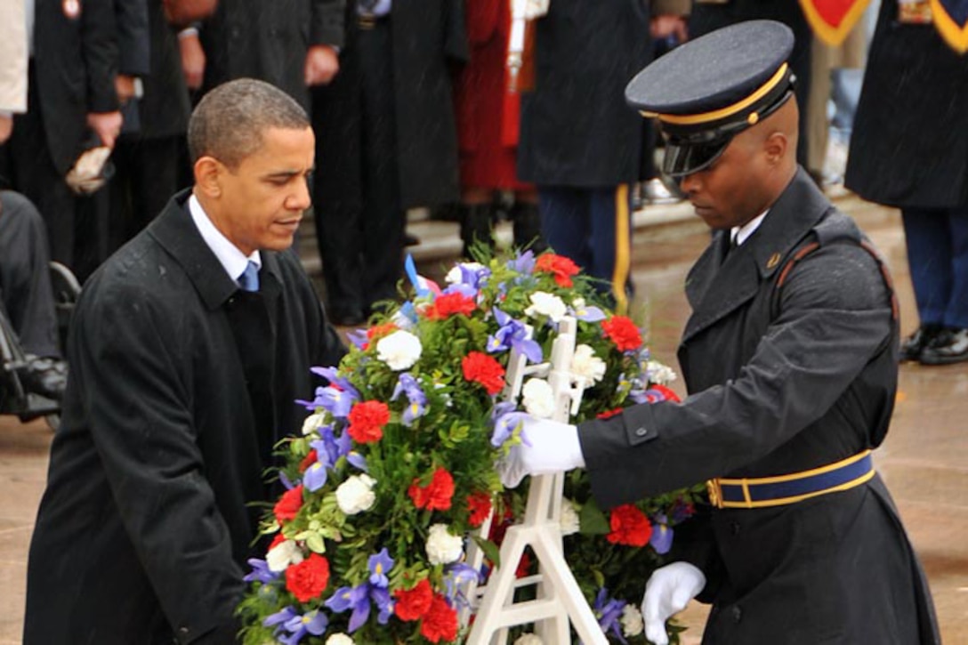 President Barack Obama Places A Wreath At The Tomb Of The Unknowns At Arlington National Cemetery