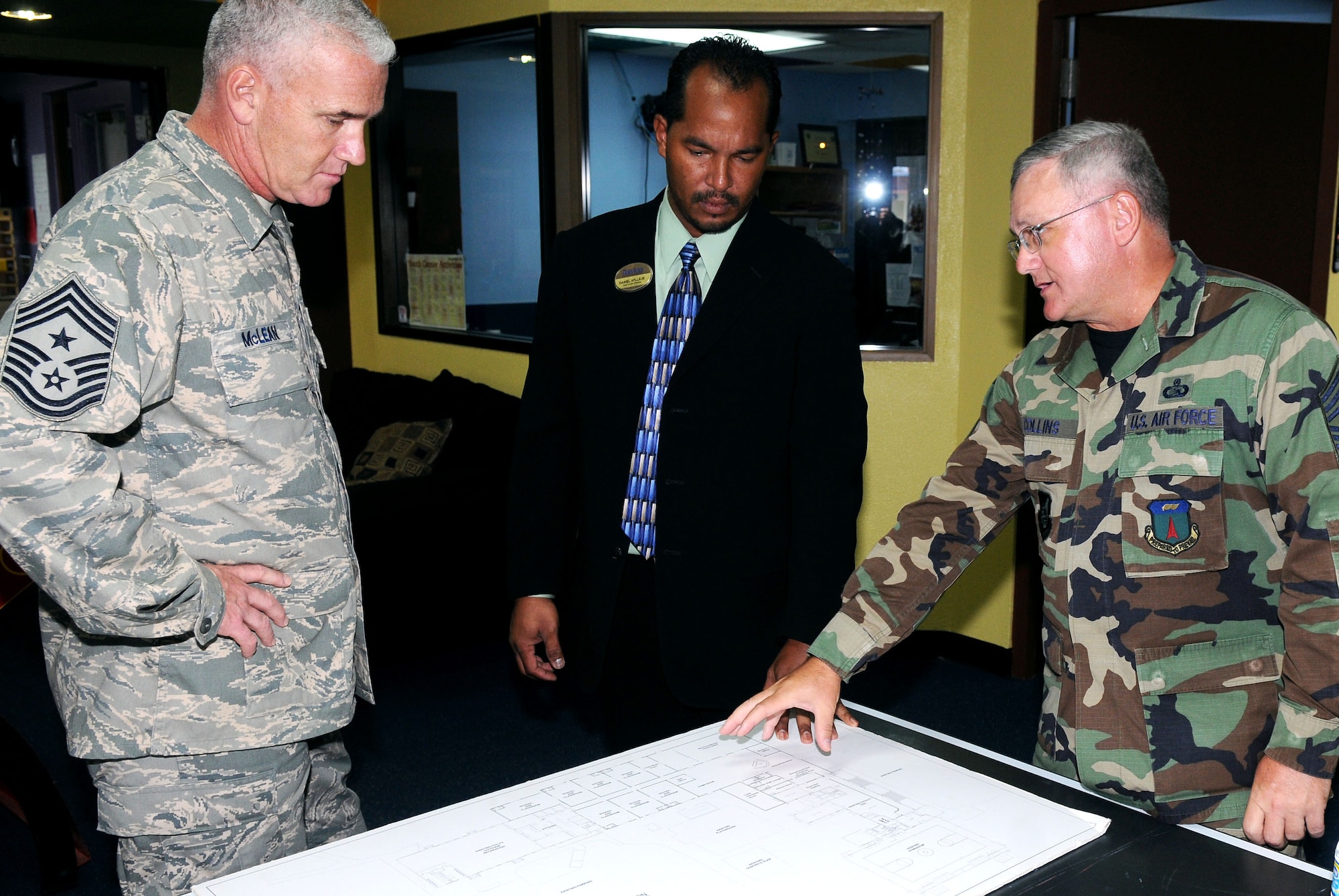 ANDERSEN AIR FORCE BASE, Guam - Pacific Air Forces Command Chief Master Sgt. Brooke McLean listens as Chief Master Sgt. Timothy Collins, 36th Mission Support Group superintendent, discusses future renovation plans for the Youth Center during a site visit here on November 10. This is Chief McLean's first visit to Andersen since being named command chief of PACAF. (U.S. photo by Airman 1st Class Julian North)
