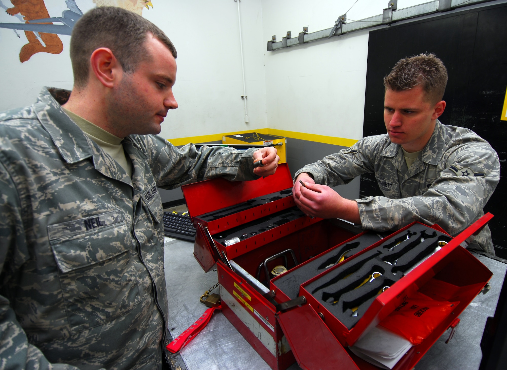 MISAWA AIR BASE, Japan—Senior Airman Paul Neil, 14th Aircraft Maintenance Unit crew chief, a native of Grand Rapids, Mich., helps Airman Nickolas Bennett, 14th AMU avionics technician, a native of Eagle, Idaho, inventory and inspect a tool box in the 14th AMU support section Nov. 12. The support section employs maintainers who work on the flightline. (U.S. Air Force photo/Staff Sgt. Phillip Butterfield)