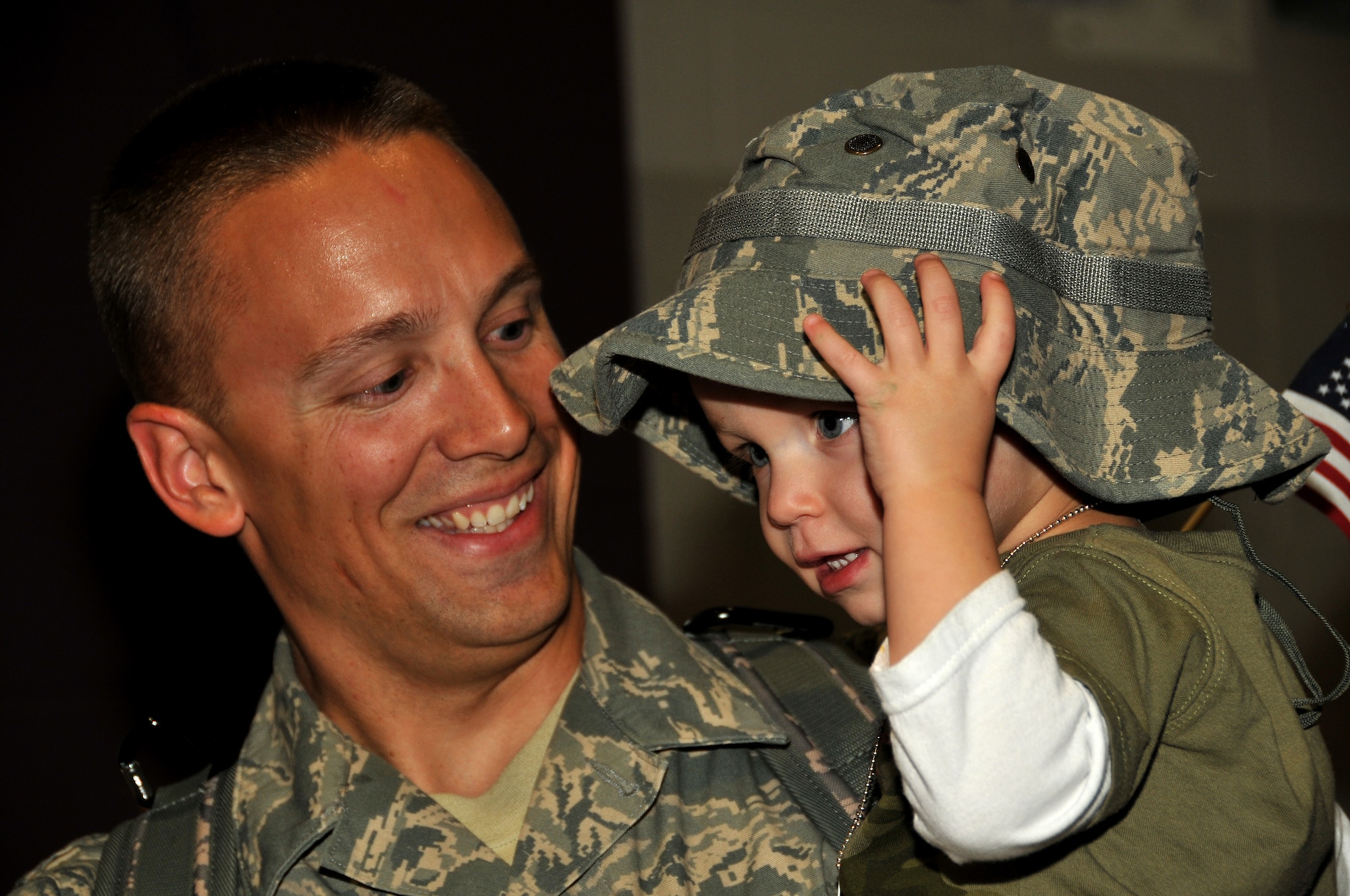 Technical Sgt. Matthew Stai, an Aircraft Armament Systems Craftsman with the 115th Fighter Wing in Madison, Wis., holds his son Ethan after returning home from a two month deployment to Iraq Nov. 12, 2009. The unit deployed approximately 200 members as part of its scheduled Air Expeditionary Force rotation. (U.S. Air Force photo by Master Sgt. Dan Richardson)