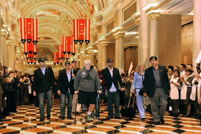 LAS VEGAS-- Several wounded veterans are greeted by Venetian Hotel employees Nov. 11 at the Venetian Hotel and Casino. In honor of Veterans Day, more than 75 wounded warriors and their spouses were flown to Las Vegas for a weekend of relaxation and entertainment.  
(U.S. Air Force Photo by Airman 1st Class Jamie Nicley)