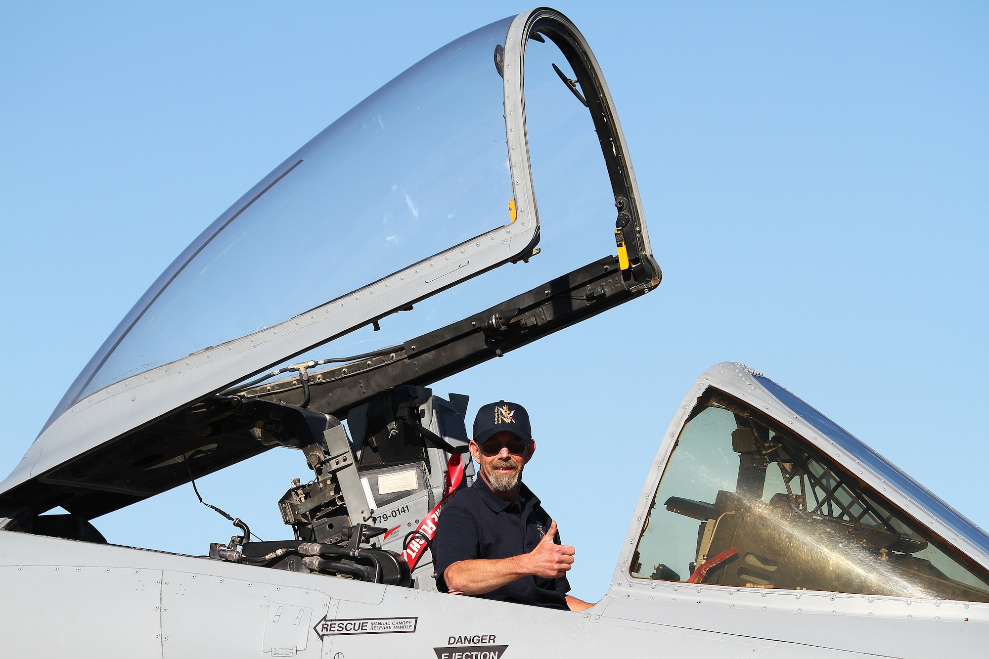 Tim O'Dell poses in the cockpit of an A-10 Thunderbolt C named for his father, Leonard O'Dell. Three former pilots and crew chiefs of the 23rd Fighter Group, Moody Air Force Base, Ga., were honored with their names stenciled on the side of the plane. "I've read all the history books regarding this group, but these guys are the real heroes," said Col. Skip Hinman, 23rd Fighter Group commander. "Though just a few names are recognized today, they really symbolize all of the Flying Tigers and the planes we've flown."