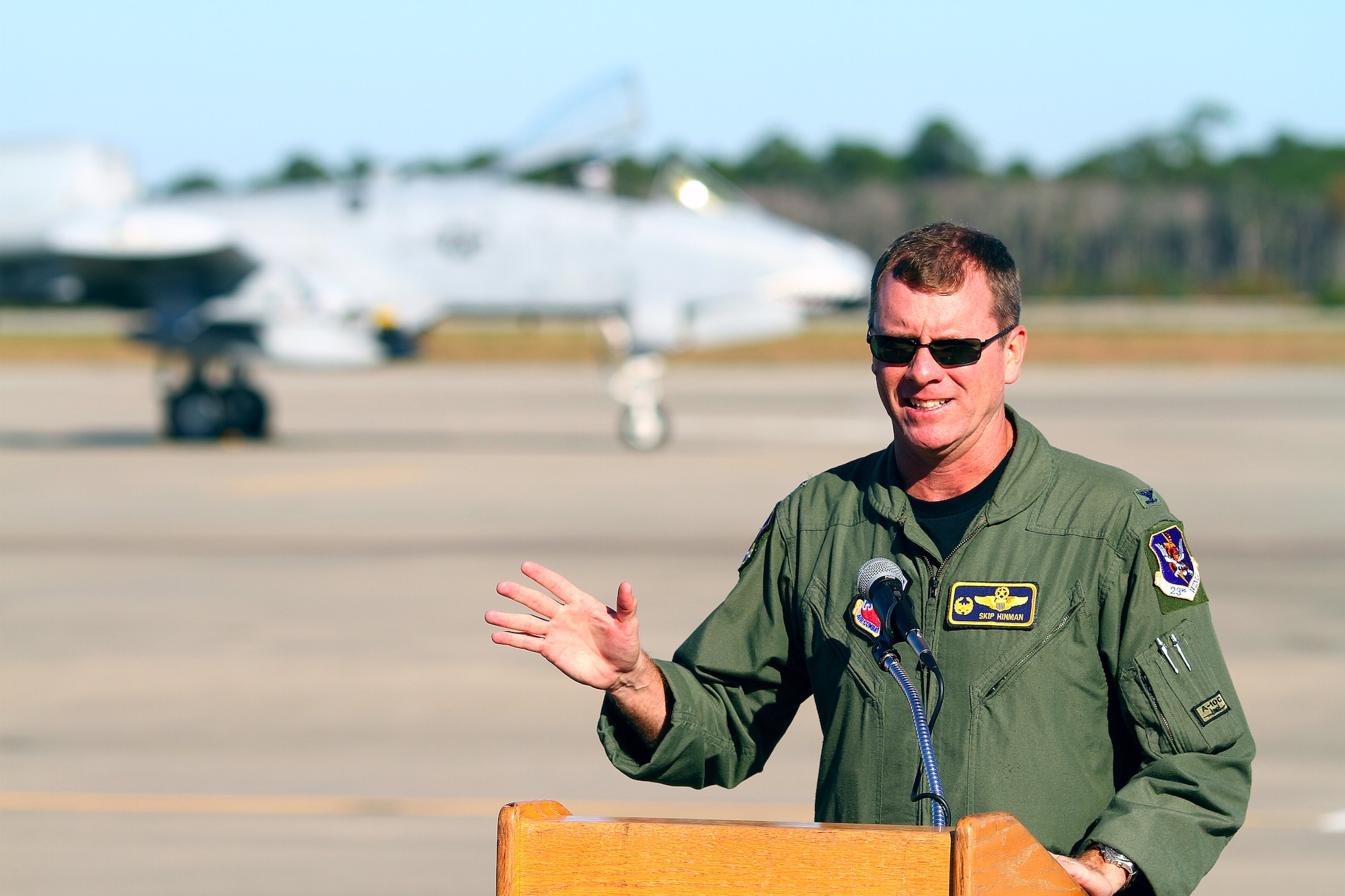 Col. Skip Hinman, 23rd Fighter Group commander, speaks to the crowd at a ceremony at Hurlburt Field, Fla., Nov. 12. Three former pilots and crew chiefs of the 23rd Fighter Group, Moody Air Force Base, Ga., were honored with their names stenciled on the side of the plane. "I've read all the history books regarding this group, but these guys are the real heroes," said Colonel Hinman. "Though just a few names are recognized today, they really symbolize all of the Flying Tigers and the planes we've flown." 