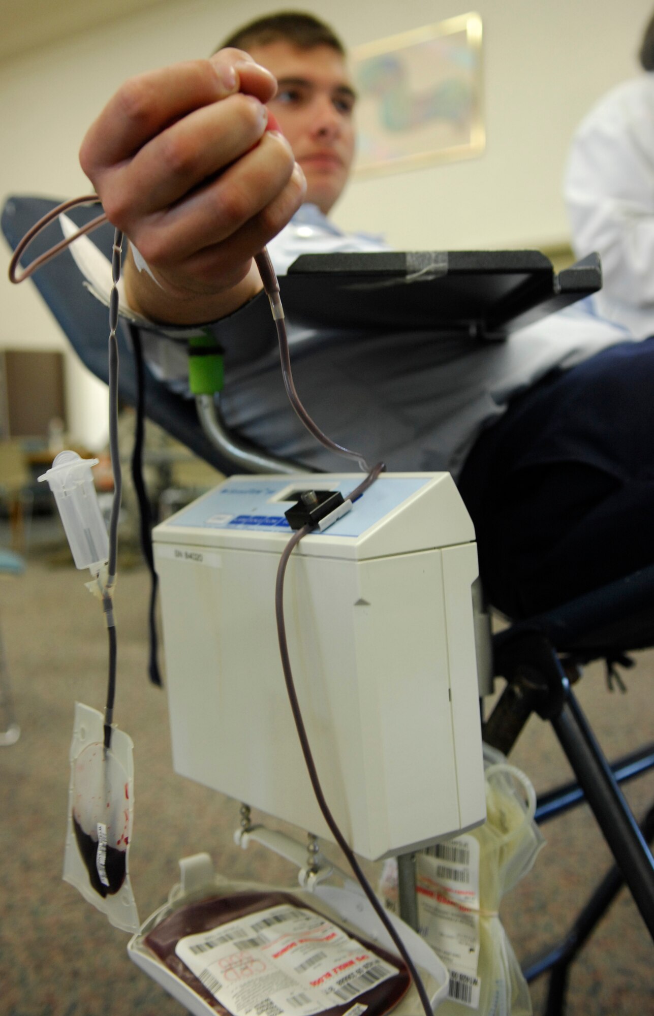 VANDENBERG AIR FORCE BASE, Calif. -- After collecting a blood donation, United Blood Services registered nurse Deanna Soderholm, removes the needle from a patient's arm during a blood drive held at the education center here Monday, Nov. 9, 2009. Blood drives help collect blood for the more than 60 percent of the population that will need to receive blood at some point in their life. (U.S. Air Force photo/Airman 1st Class Heather R. Shaw)
