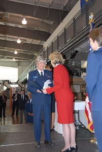 Senator Kay Bailey Hutchison R-Texas presents Betty Jo Streff Reed, a former Women Airforce Service Pilot, with a commerorative copy of Bill 111-40, which was passed by Congress to award the WASP a Congressional Gold Medal, the highest honor Congress can bestow a civilian for service to thier country, as Col. Jacqueline Van Ovost, 12th Flying Training Wing commander and guest speaker looks on. (Photo by Senior Airman Katie Hickerson)
