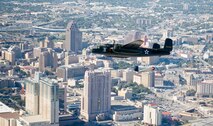 The B-25 Mitchell bomber "Special Delivery" and a replica Japanese A6M2 Zero fly over downtown San Antonio Nov. 5, 2009. The flight team from the Disabled American Veterans organized flights aboard historic and experimental aircraft for wounded warriors from the San Antonio Military Medical Center at Fort Sam Houston, Texas. (U.S. Air Force photo/Lance Cheung)
