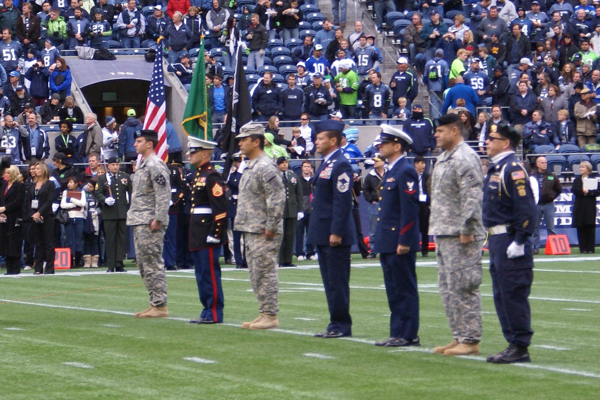SEATTLE - Chief Master Sgt. Mitch Coley, 446th Civil Engineer Squadron Explosive Ordnance Flight, McChord Air Force Base, Wash.,, represents the Air Force Reserve at the Nov. 8 Seattle Seahwaks game against the Detroit Lions.  The Seahawks paid tribute to the military services during pre-game activities. Servicemembers from each military branch were honored for their service to the country.  (U.S. Air Force photo/Staff Sgt. Eric Burks)