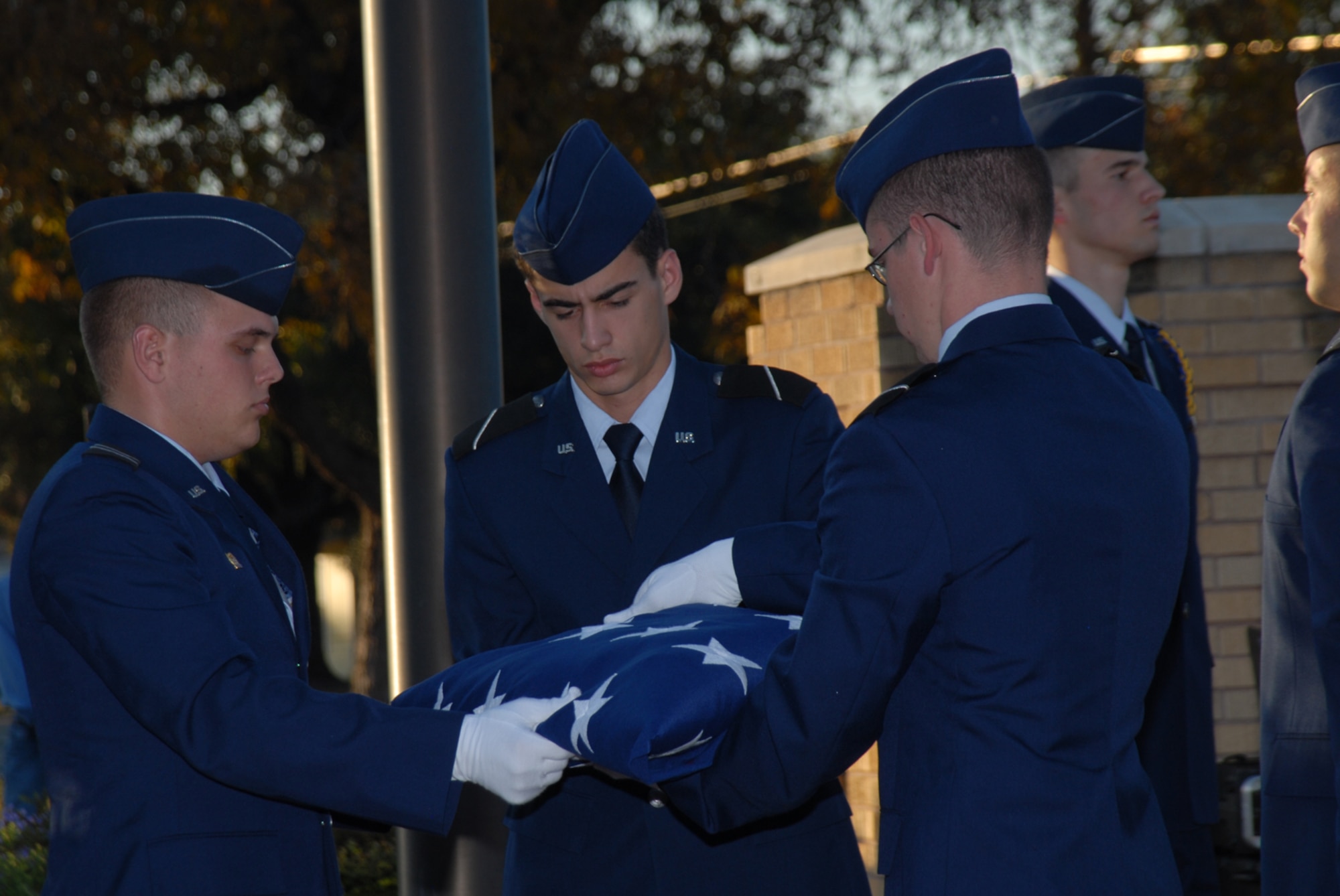 SAN ANGELO, Texas -- Angelo State University ROTC cadets fold the flag at the campus flag pole during a retreat ceremony honoring veterans, Nov. 11, 2009. (U.S. Air Force photo/Staff Sgt. Laura R. McFarlane)
