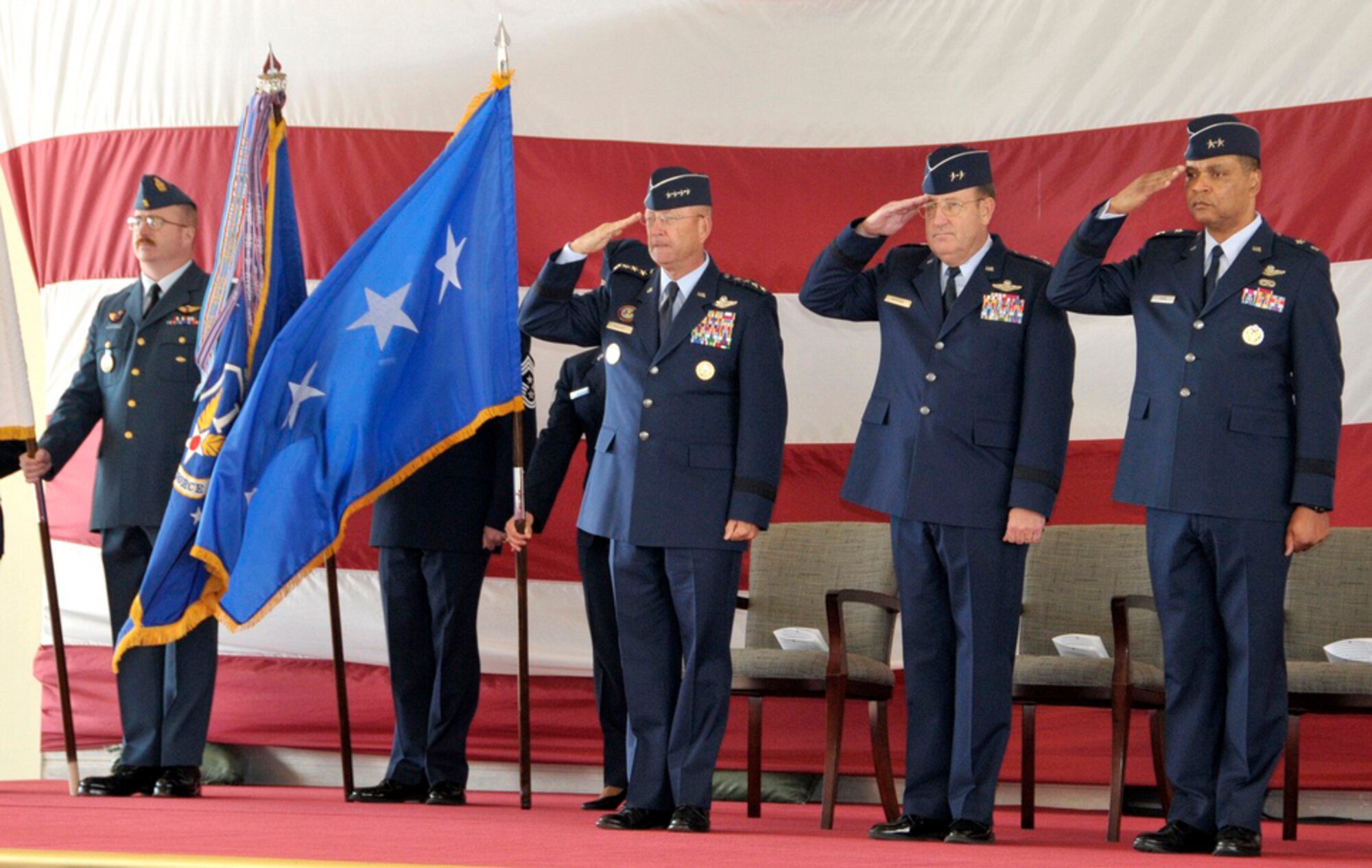 Gen. Gene Renuart, Maj. Gen. Hank Morrow and Maj. Gen. Garry Dean render a salute as the National Anthem plays during the Continental U.S. NORAD Region-1st Air Force (Air Forces Northern) change of command ceremony Nov. 12 at Tyndall AFB, Fla. (U.S. Air Force photo by Lisa Norman)
