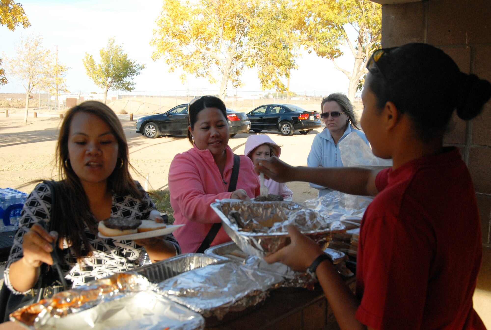 Attendees of Pancho Barnes Day enjoy free food Nov. 7. The annual event is held to recognize the contributions of females to aviation. (Air Force photo/Airman 1st Class William O'Brien)