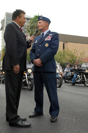 LAS VEGAS -- Col. Dave Belote, 99th Air Base Wing commander, is interviewed by Mr. Steven Schorr, Cox Communications vice president, during the 2009 Las Vegas Veteran's Day Parade Nov. 11.   Veteran's Day recognizes and honors all who have served in the U.S. Armed Forces.  (U.S. Air Force photo/ Staff Sgt. Taylor Worley)    