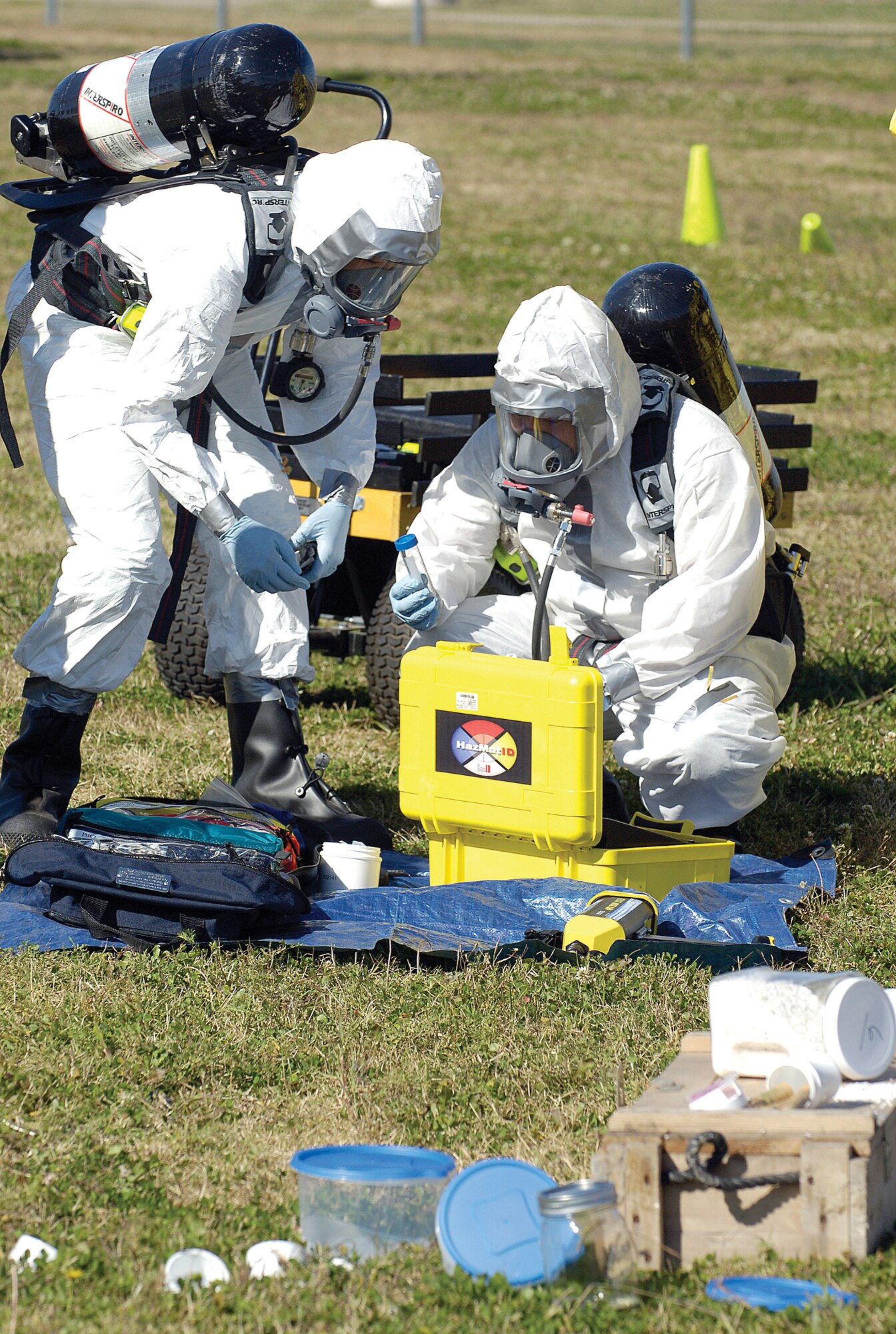 Bioenvironmental Engineering Airmen in protective gear prepare to take samples of unknown chemicals during a Major Accident Response Exercise scenario at the Tinker softball fields last week. (Air Force photo by Margo Wright)