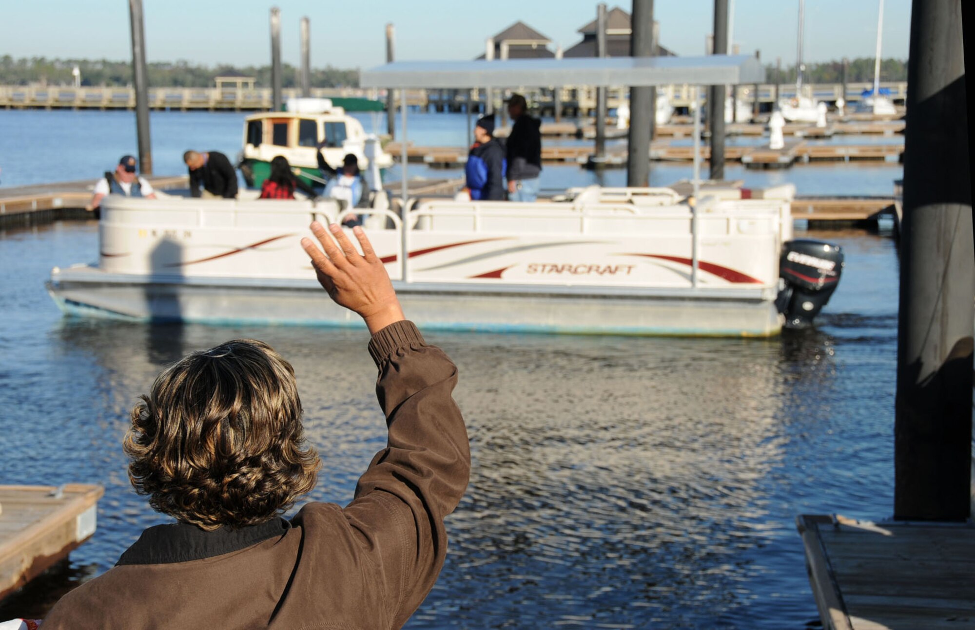 Donna Anderson, 81st Medical Group wounded warrior program manager, waves goodbye to participants on a fishing trip courtesy of the 81st Mission Support Group’s Services Division.  Other Warrior Care Month events are Saturday’s Warrior Walk, 7-11 a.m. on the Ocean Springs/Biloxi Bridge and a warrior outreach day, 9 a.m. to 2 p.m. Nov. 19 in the Keesler Medical Center auditorium.   (U.S. Air Force photo by Kemberly Groue)