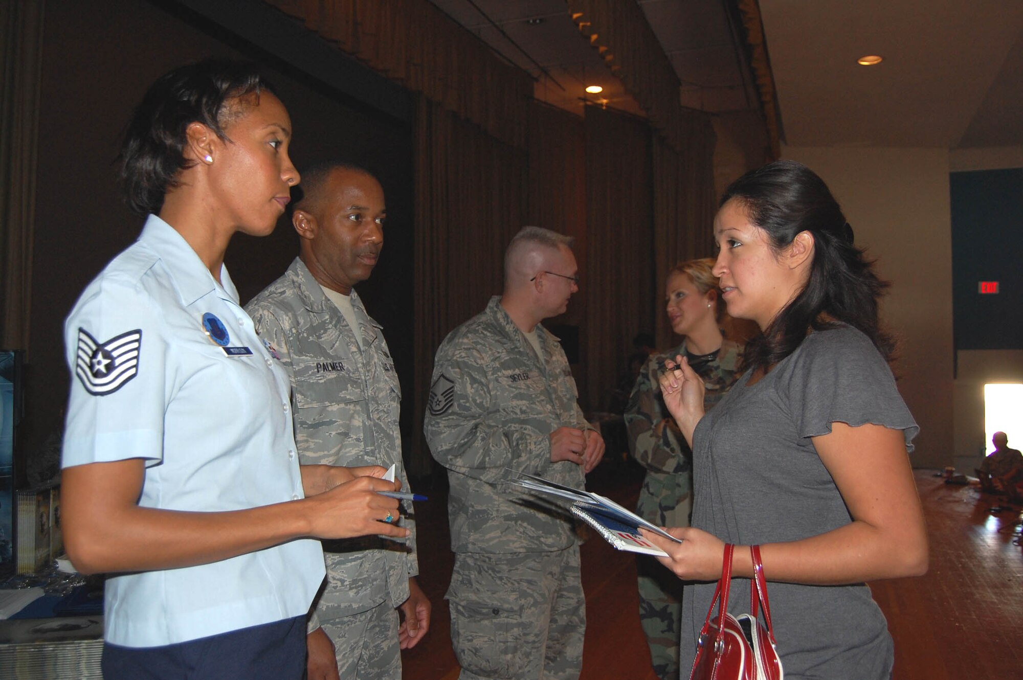 An Individual Ready Reserve member (right) speaks to Tech. Sgt. Alexis Morrison and Master Sgt. Kenneth Palmer, Air Force Reserve recruiters, about job opportunities during an Enhanced Muster held at Nellis Air Force Base, Nev., on Nov. 6. More than 60 IRR members participated in the first event of its kind for Air Reserve Personnel Command.