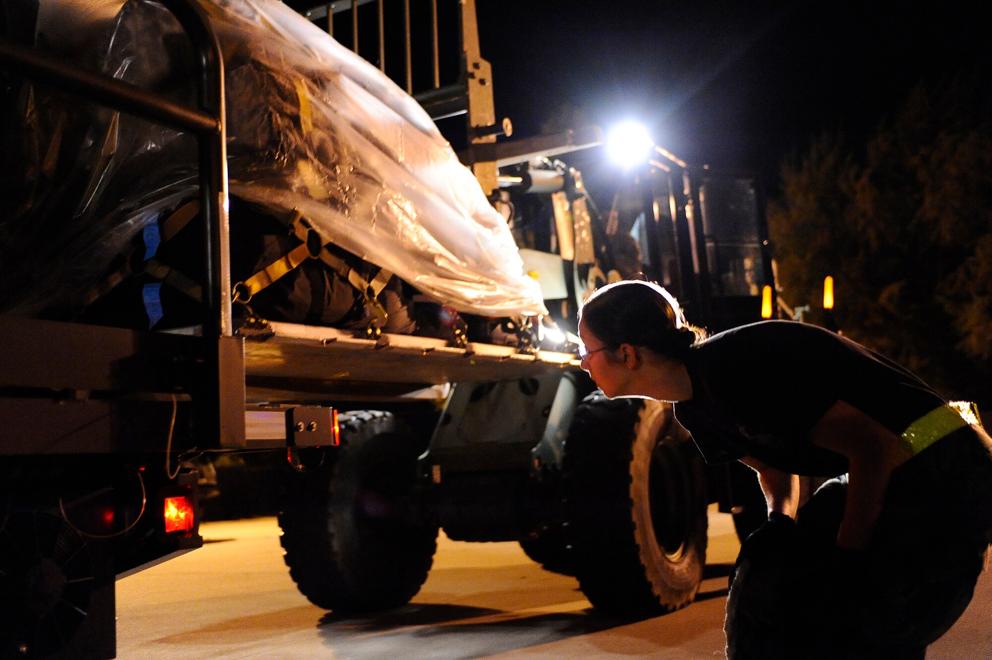 U.S. Air Force Airman 1st Class Maria Propson, 1st Special Operations Logistics Readiness Squadron, spots a pallet of hurricane supplies as it?s loaded, Hurlburt Field, Fla., Nov. 8, 2009. Hurlburt Field assets were being evacuated as Hurricane Ida approaches the Gulf Coast region. (U.S. Air Force photo by Senior Airman Julianne Showalter/Released)