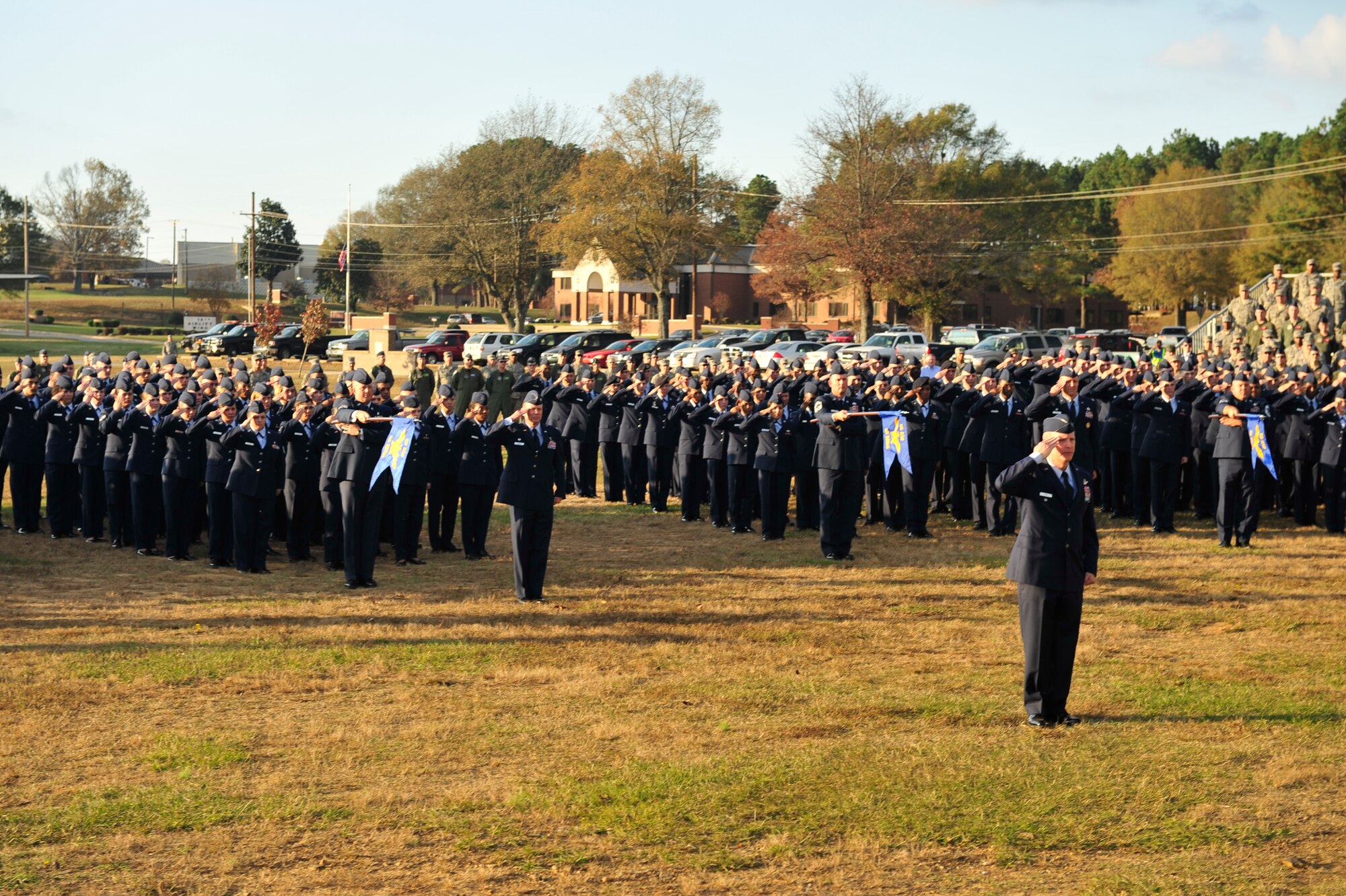 Col. Mike Zick, 19th Airlift Wing vice commander, presents arms along with base personnel Nov. 10 during a Veterans Day retreat at Little Rock Air Force Base. On June 1, 1954, Congress voted to change Nov. 11 from “Armistice Day” to “Veterans Day” to honor American Veterans of all wars.  (U.S. Air Force photo by Airman 1st Class Lausanne Pacheco)