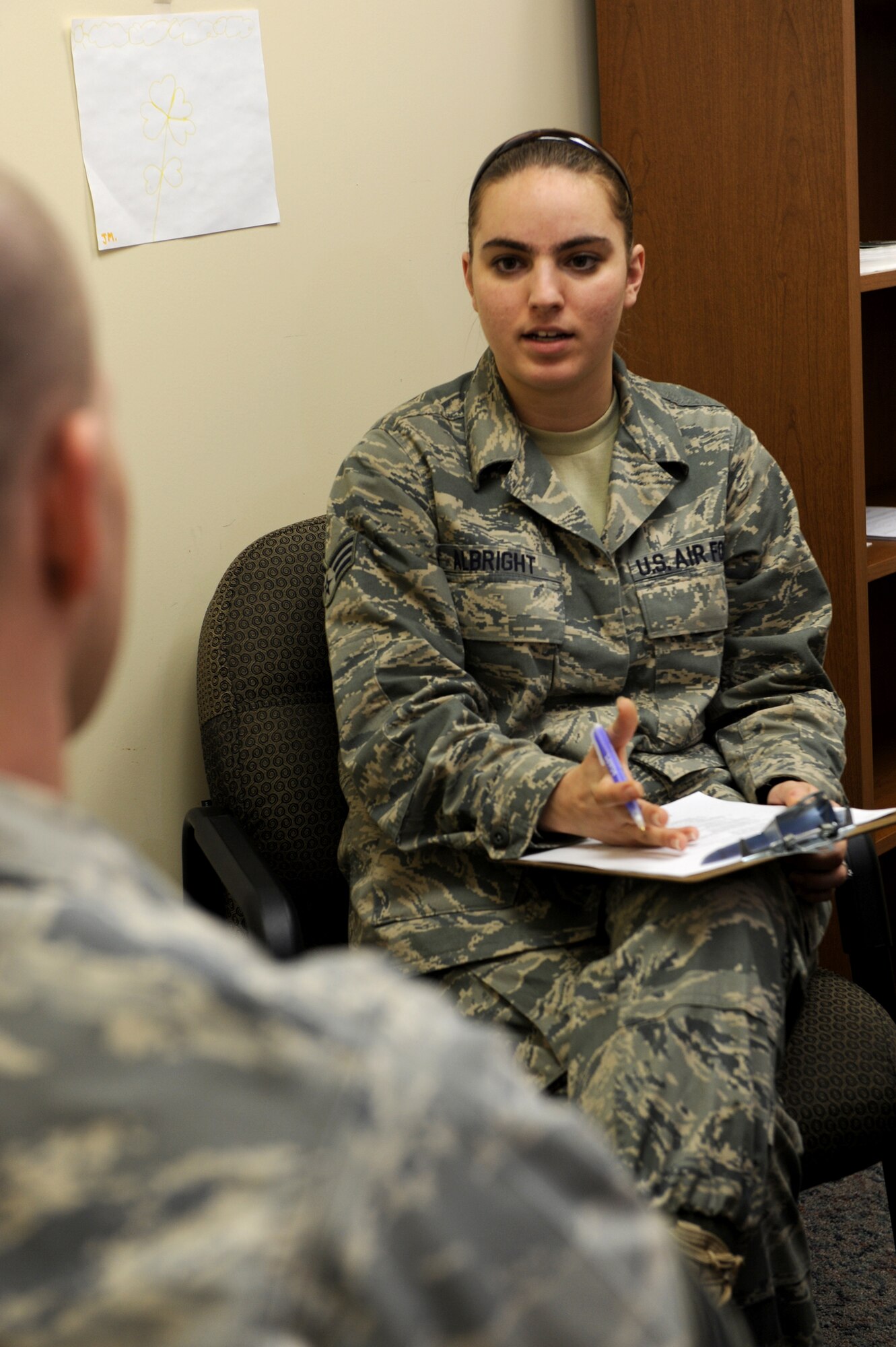 MINOT AIR FORCE BASE, N.D. -- Senior Airman Ashley Albright, 5th Medical Operations Squadron mental health technician, asks routine questions to a patient here Nov 3. Airman Albright was recognized as an outstanding performer during the 5th Medical Group’s recent Air Force Inspection Agency Health Services Inspection. The medical group was rated outstanding in eight of the 16 topical graded areas and captured an overall excellent rating for the HSI. (U.S. Air Force photo by Tech. Sgt. Lee A. Osberry Jr.)
