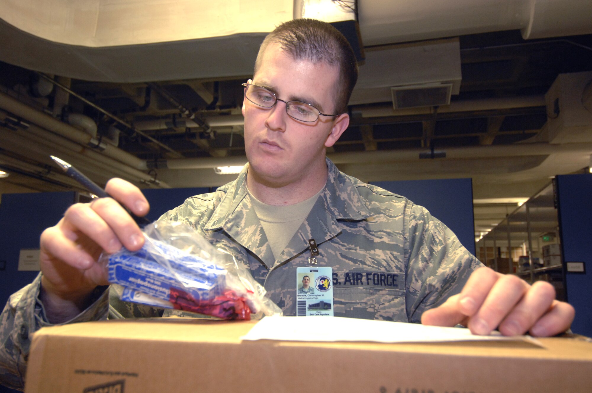 MINOT AIR FORCE BASE, N.D. -- Senior Airman Christopher Broadie, 5th Medical Group medical logistics materiel journeyman, catalogs various medical supplies delivered to the storage distribution center here Nov. 6. Medical Logistics receives miscellaneous medical supplies, including those involving dental, physical therapy and laboratory work.  Airman Broadie was recognized as an outstanding performer during the 5th MDG’s recent Air Force Inspection Agency Health Services Inspection. The medical group was rated an outstanding in eight of the 16 major graded areas and captured an overall excellent rating for the HSI. (U.S. Air Force photo by Airman 1st Class Jesse Lopez)