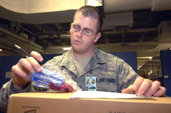MINOT AIR FORCE BASE, N.D. -- Senior Airman Christopher Broadie, 5th Medical Group medical logistics materiel journeyman, catalogs various medical supplies delivered to the storage distribution center here Nov. 6. Medical Logistics receives miscellaneous medical supplies, including those involving dental, physical therapy and laboratory work.  Airman Broadie was recognized as an outstanding performer during the 5th MDG’s recent Air Force Inspection Agency Health Services Inspection. The medical group was rated an outstanding in eight of the 16 major graded areas and captured an overall excellent rating for the HSI. (U.S. Air Force photo by Airman 1st Class Jesse Lopez)