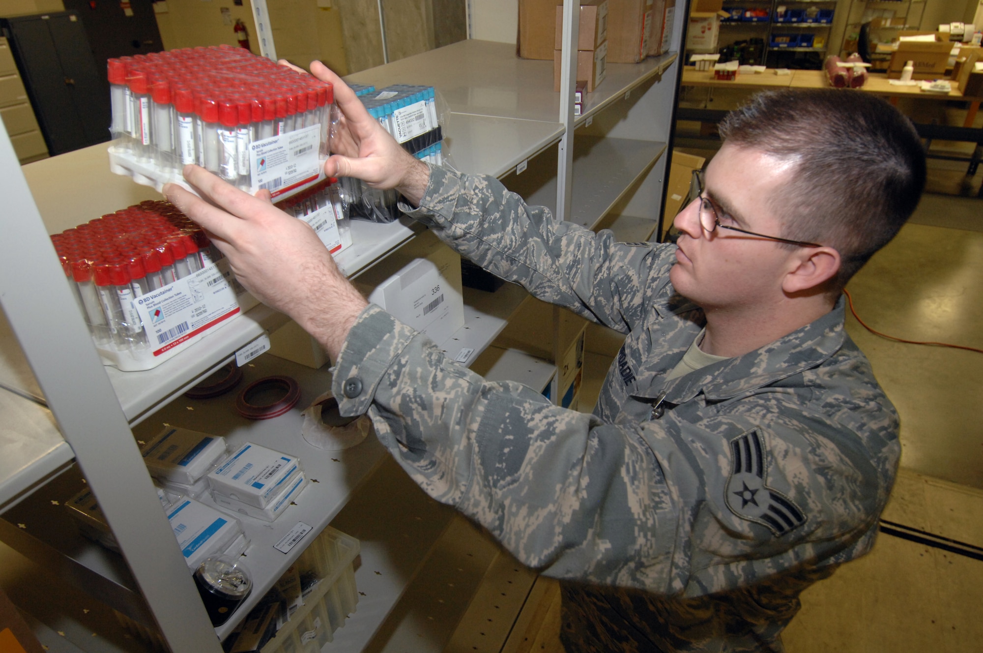 MINOT AIR FORCE BASE, N.D. -- Senior Airman Christopher Broadie, 5th Medical Group medical logistics materiel journeyman, stocks blood collection tubes onto the warehouse shelving of the storage distribution here Nov. 6. Medical Logistics receives miscellaneous medical supplies, including those involving dental, physical therapy and laboratory work.  Airman Broadie was recognized as an outstanding performer during the 5th MDG’s recent Air Force Inspection Agency Health Services Inspection. The medical group was rated an outstanding in eight of the 16 major graded areas and captured an overall excellent rating for the HSI. (U.S. Air Force photo by Airman 1st Class Jesse Lopez)