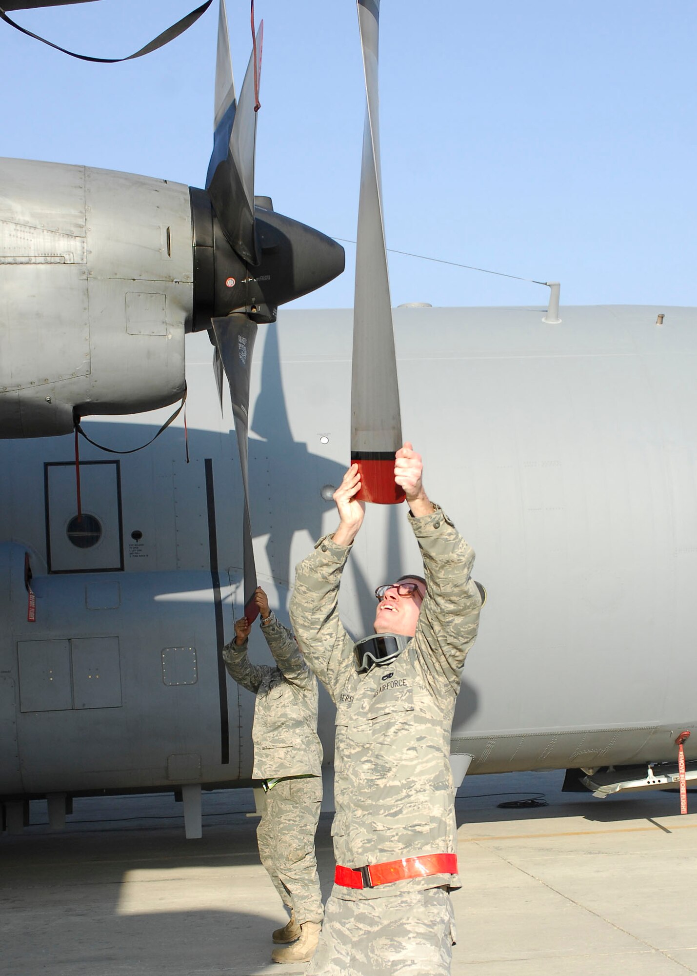 BAGRAM AIRFIELD, Afghanistan -- Tech. Sgt. Lee Fortner (left) and Airman First Class Jared Culberson (right) inspect the propellers of the EC-130 Compass Call Nov. 12, 2009.  Both Airmen are crew chiefs deployed from Davis-Monthan Air Force Base, Ariz.  Sergeant Fortner hails from Las Vegas and Airman Culberson hails from Douglasville, Ga.  (U.S. Air Force photo/Senior Airman Felicia Juenke)