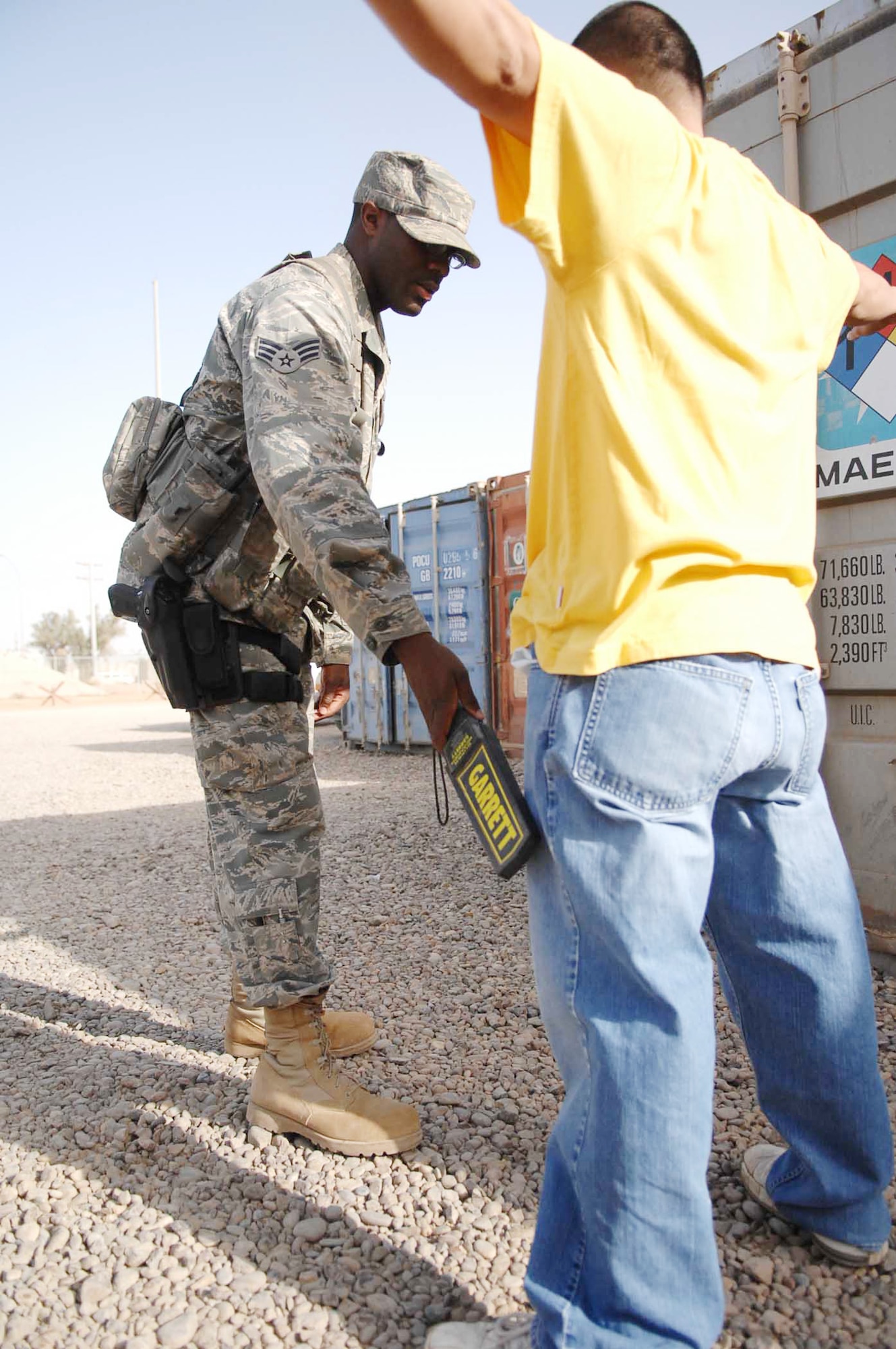 Senior Airman Rodney Creekmore conducts a random transfrisk on a third-country national Nov. 6, 2009, at Joint Base Balad, Iraq. Airman Creekmore is a 332nd Expeditionary Security Forces Squadron patrolman. Transfrisking is one of the mitigation techniques used by 332nd SFS Airmen when conducting random antiterrorism measures. (U.S. Air Force photo/Senior Airman Andria J. Allmond)
