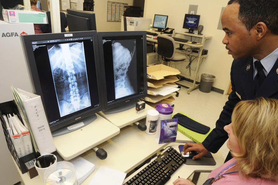 SSgt. Maurice Hazelton and Angie Eubanks perform quality control of some X-ray images. U. S. Air Force photo by Sue Sapp