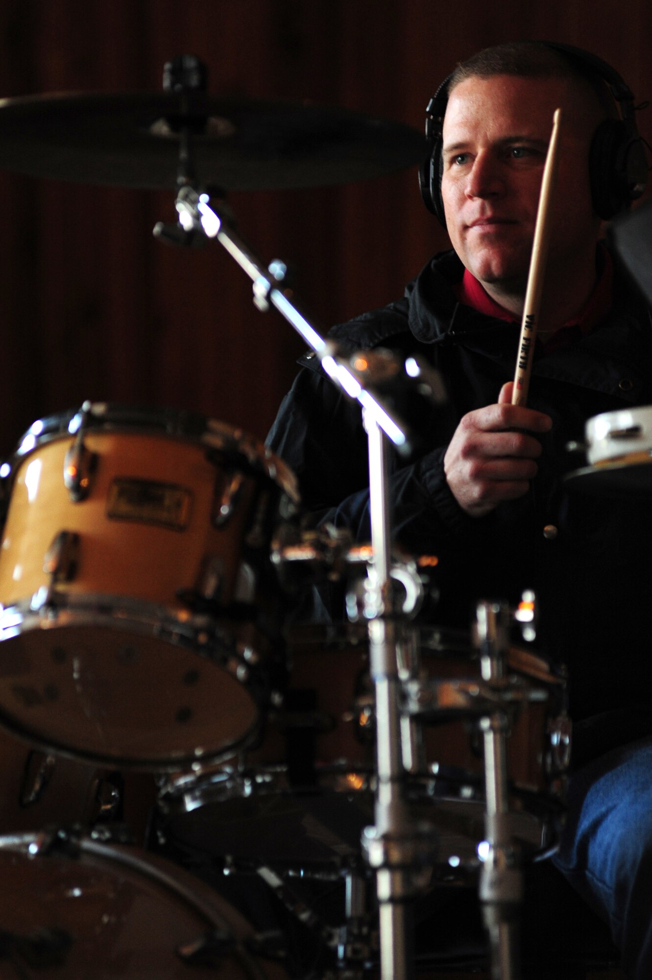 BISHKEK, Kyrgyzstan -- Master Sgt. Anthony DeLuzio, U.S. Air Forces Central Sirocco Band drummer, keeps the rhythm during a performance at the Abdraev Boarding School of Music, Nov. 12, 2009. The Sirocco Band performs a wide variety of music ranging from modern rock, oldies, and pop. (U.S. Air Force photo/Senior Airman Steele C. G. Britton)