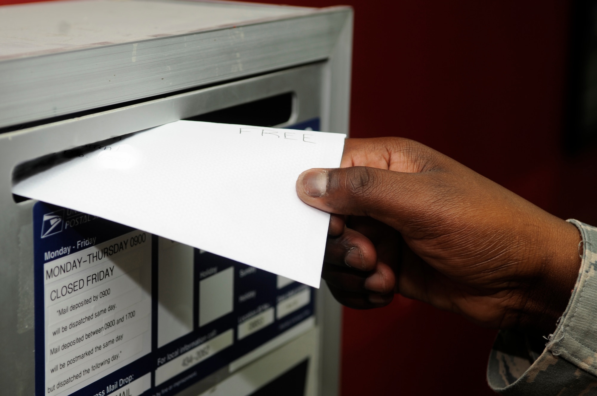 SOUTHWEST ASIA – Senior Airman Kenneth White, 380th Expeditionary Force Support Squadron, puts a letter with “FREE” written on it in a post office receptacle Nov. 12, 2009. Members of the 380th Air Expeditionary Wing are authorized to send free mail as of Nov. 10, 2009. Airman White is deployed from the 172nd Airlift Wing, Mississippi Air National Guard Wing, Jackson, Miss., and calls Hattiesburg, Miss., home. (U.S. Air Force photo/Senior Airman Stephen Linch)