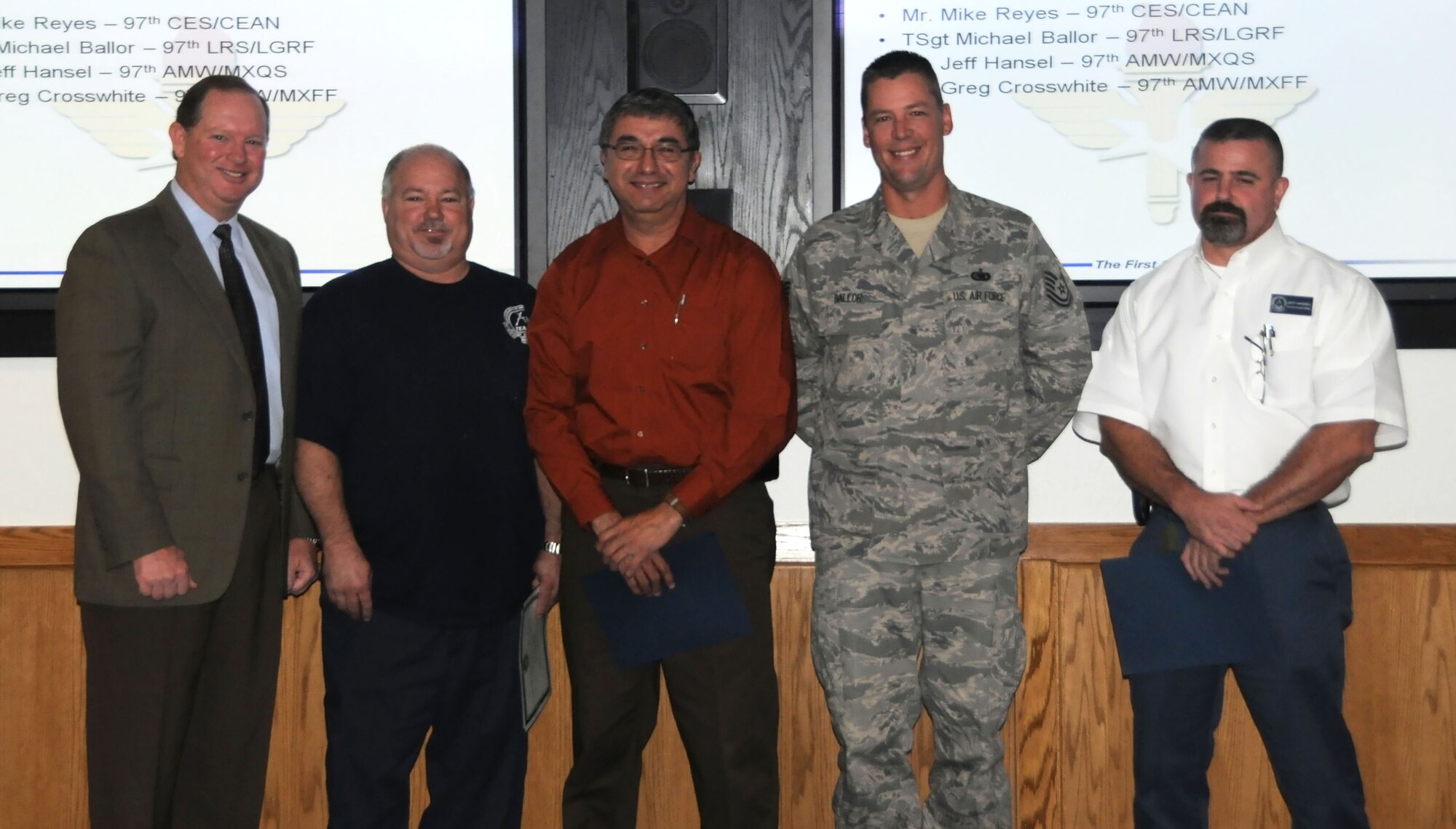 ALTUS AIR FORCE BASE, Okla. - From Left, Mr. Greg Crosswhite, Mr. Michael Reyes, TSgt Michael Ballor and Mr. Jeff Hansel, all Altus Air Force Personnel, are being awarded outstanding perfromers during the 97th Air Mobility Wing Environmental, Safety and Occupational Evaluation, Oct. 22.  The awards are being presented by David Edwards, Deputy Mission Support Group Commander at Luke Air Force Base.  (U.S. Air Force photo / SrA Cherice Bryant)