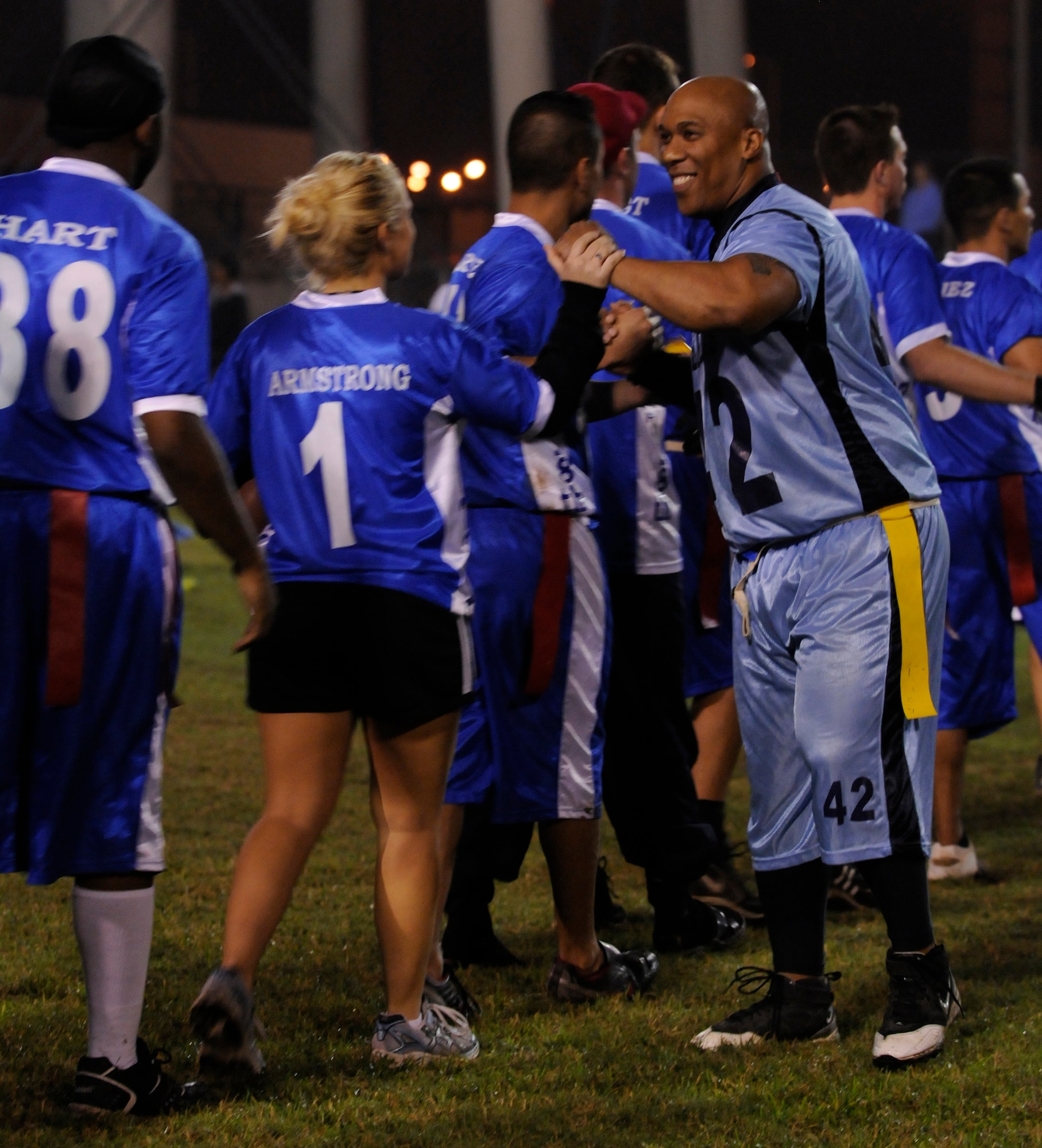 Master Sgt. Charles Thompson, 39th Security Forces Squadron, congratulates members of the 728th Air Mobility Squadron after a semi-final intramural flag football game at the Incirlik football field, Wednesday, Nov. 11, 2009. The winning team proceeded to the intramural championship game. The 728th AMS defeated the 39th SFS 19 to 14. (U.S. Air Force photo/Airman 1st Class Amber Ashcraft)