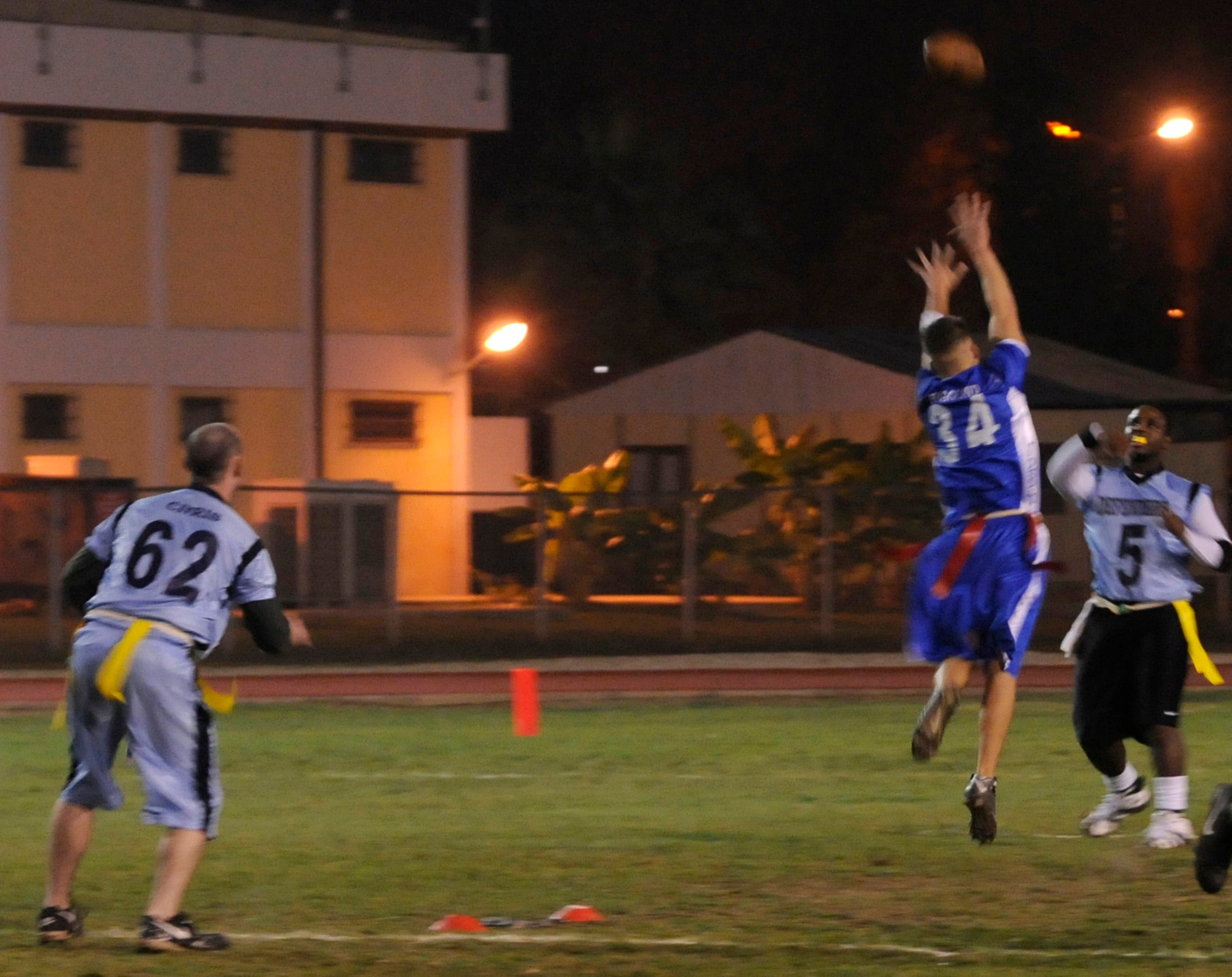 Senior Airman James Savage, 39th Security Forces Squadron, attempts a pass during a semi-final intramural flag football game at the Incirlik football field, Wednesday, Nov. 11, 2009. The winning team proceeded to the intramural championship game. The 728th AMS defeated the 39th SFS 19 to 14. (U.S. Air Force photo/Airman 1st Class Amber Ashcraft)