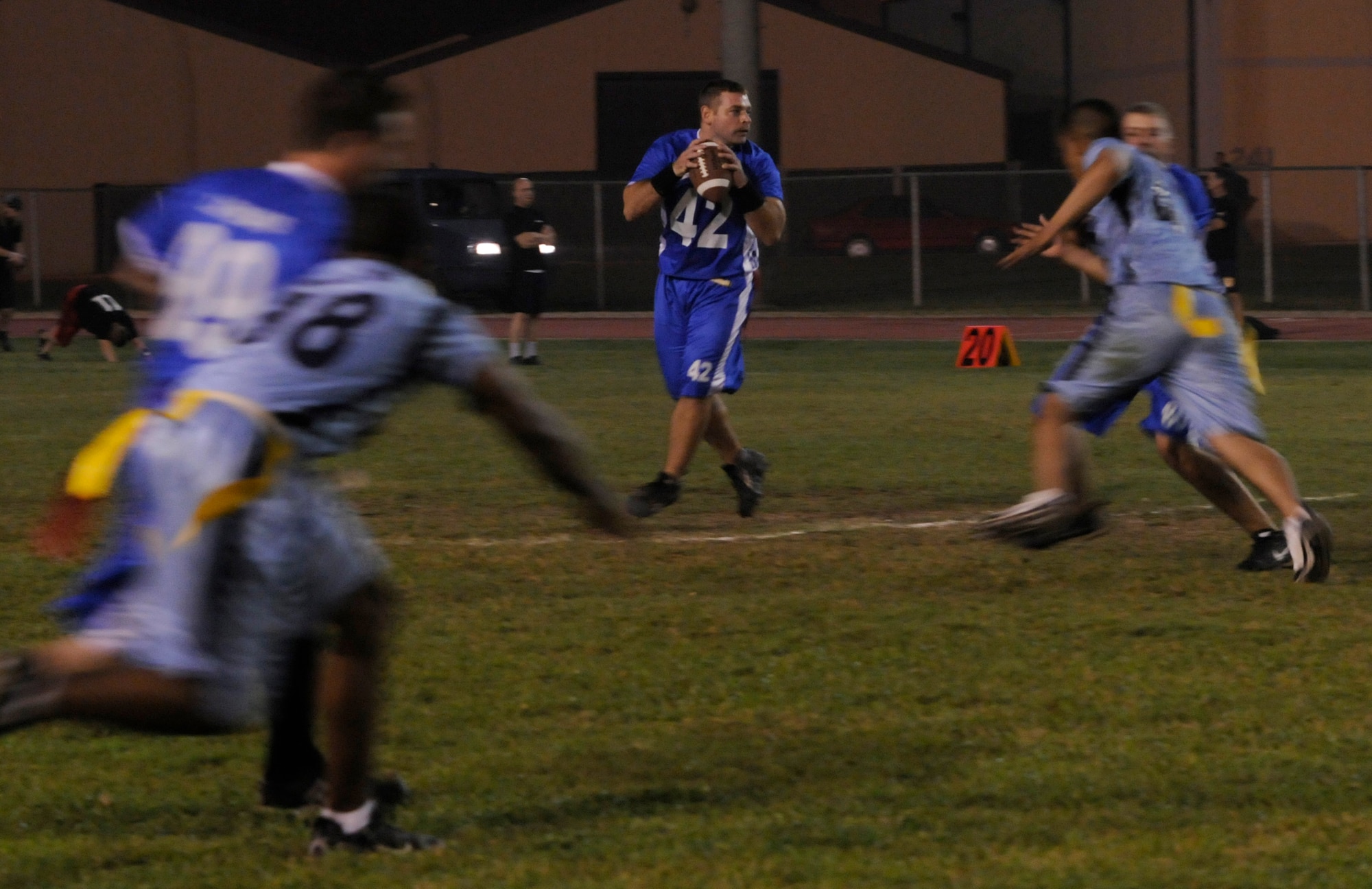 Capt. Jerry Yarrington, 728th Air Mobility Squadron, tries to find an open receiver during a semi-final intramural flag football game at the Incirlik football field, Wednesday, Nov. 11, 2009. The winning team proceeded to the intramural championship game. The 728th AMS defeated the 39th SFS 19 to 14. (U.S. Air Force photo/Airman 1st Class Amber Ashcraft)